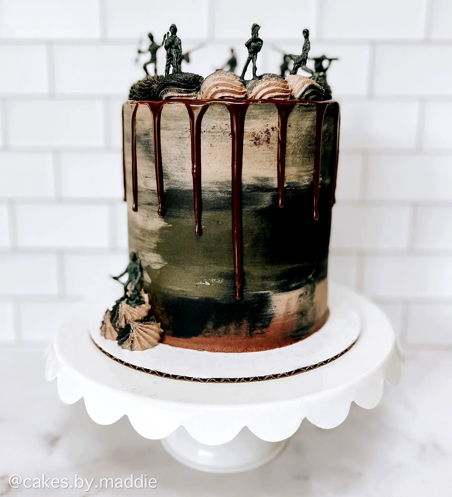 Creative birthday cake design with fun camouflage theme and playful decorations