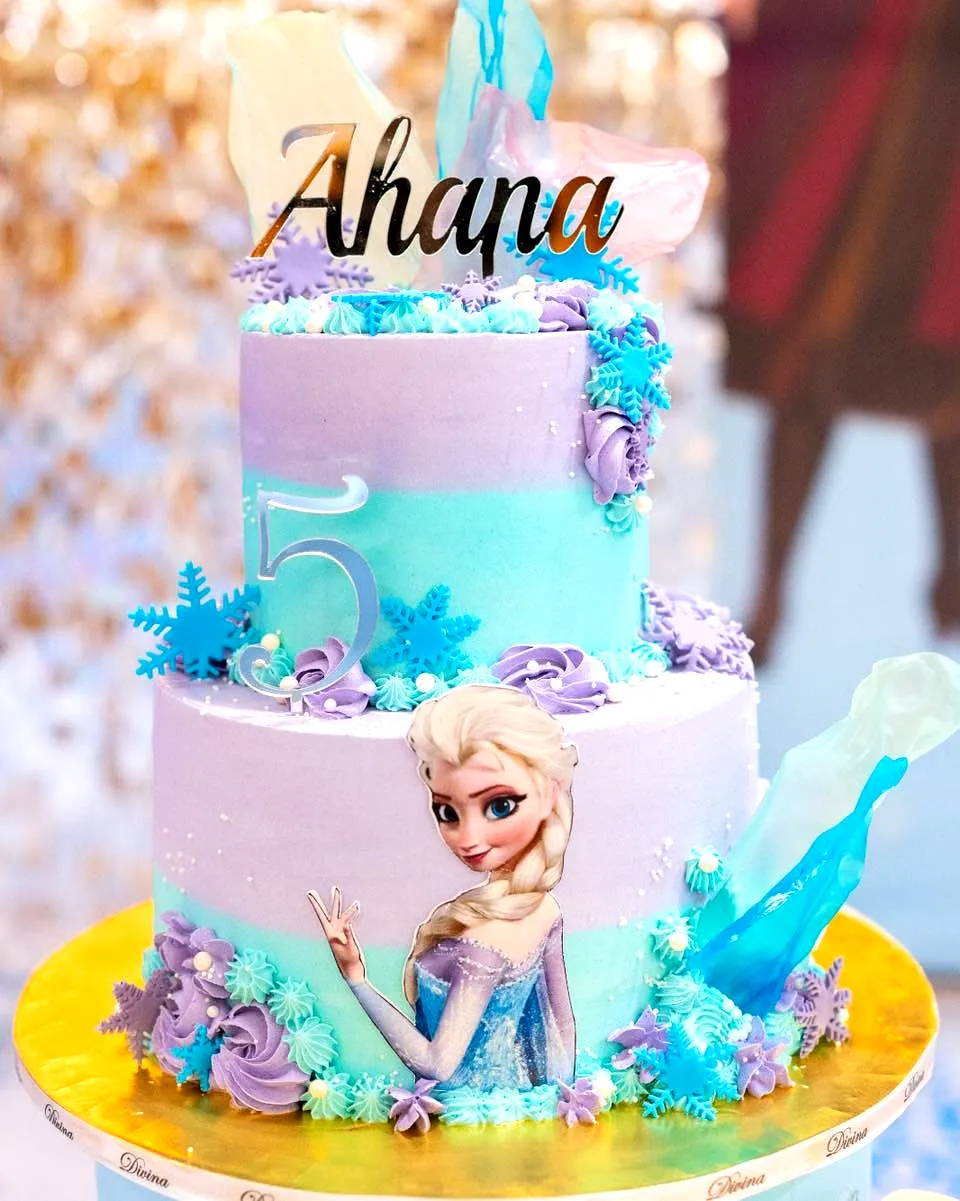Creative frozen birthday cake design in pastel shades and whimsical style