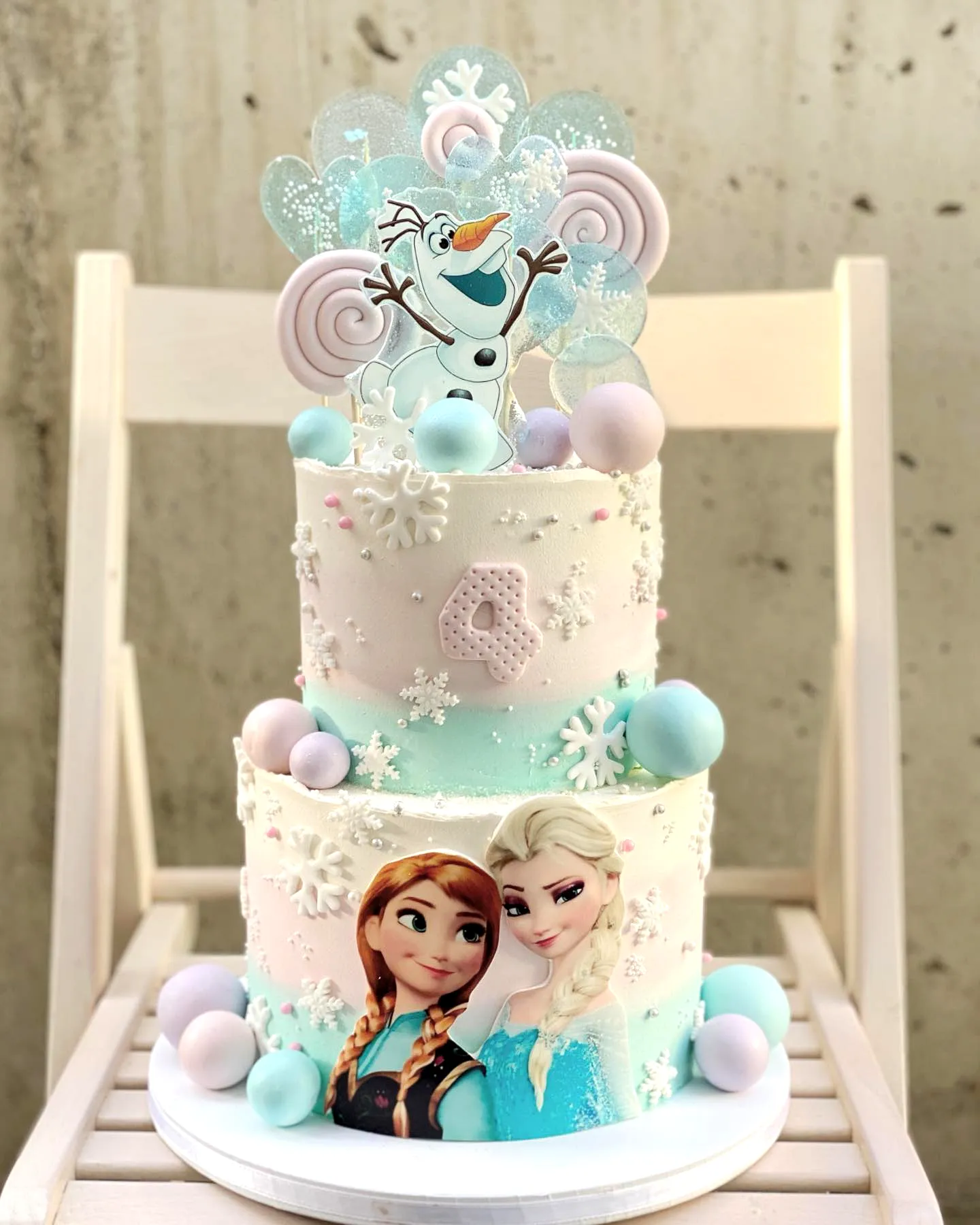 Creative Frozen Birthday Cake Design with Magical Elements and Whimsical Colors