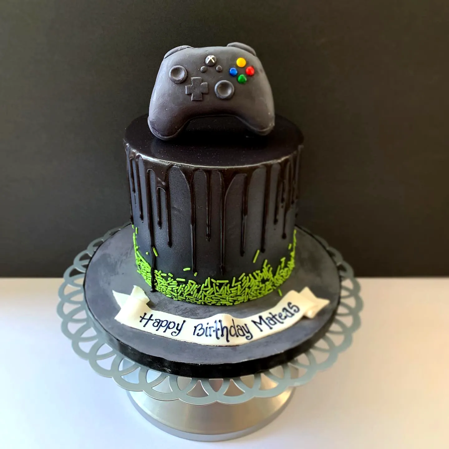 Creative gamer birthday cake design with glossy chocolate drip and Xbox controller