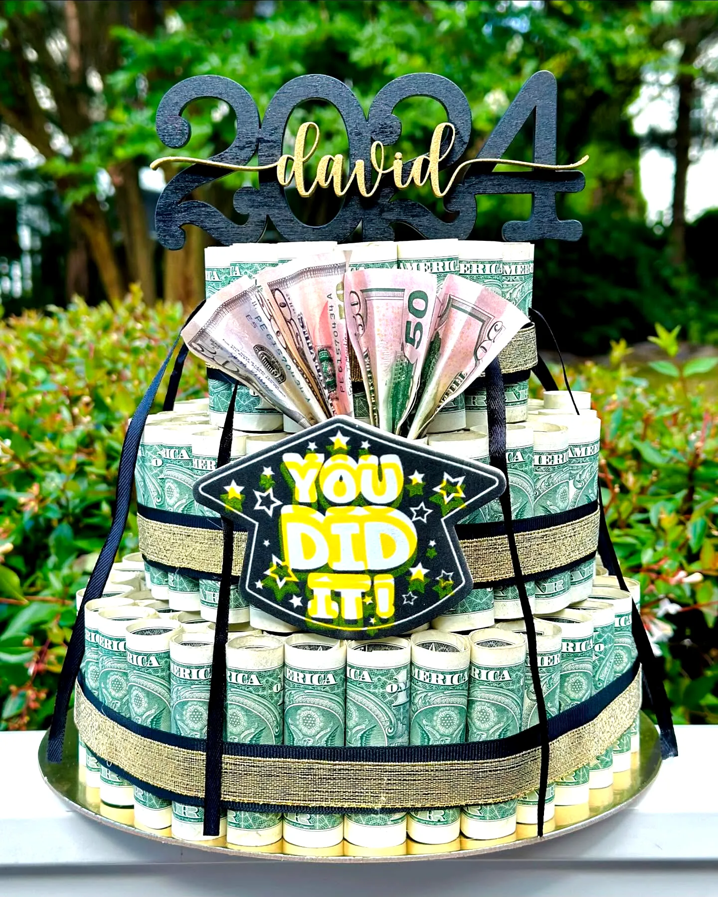 Creative Graduation Money Cake Design in Green and Gold Colors