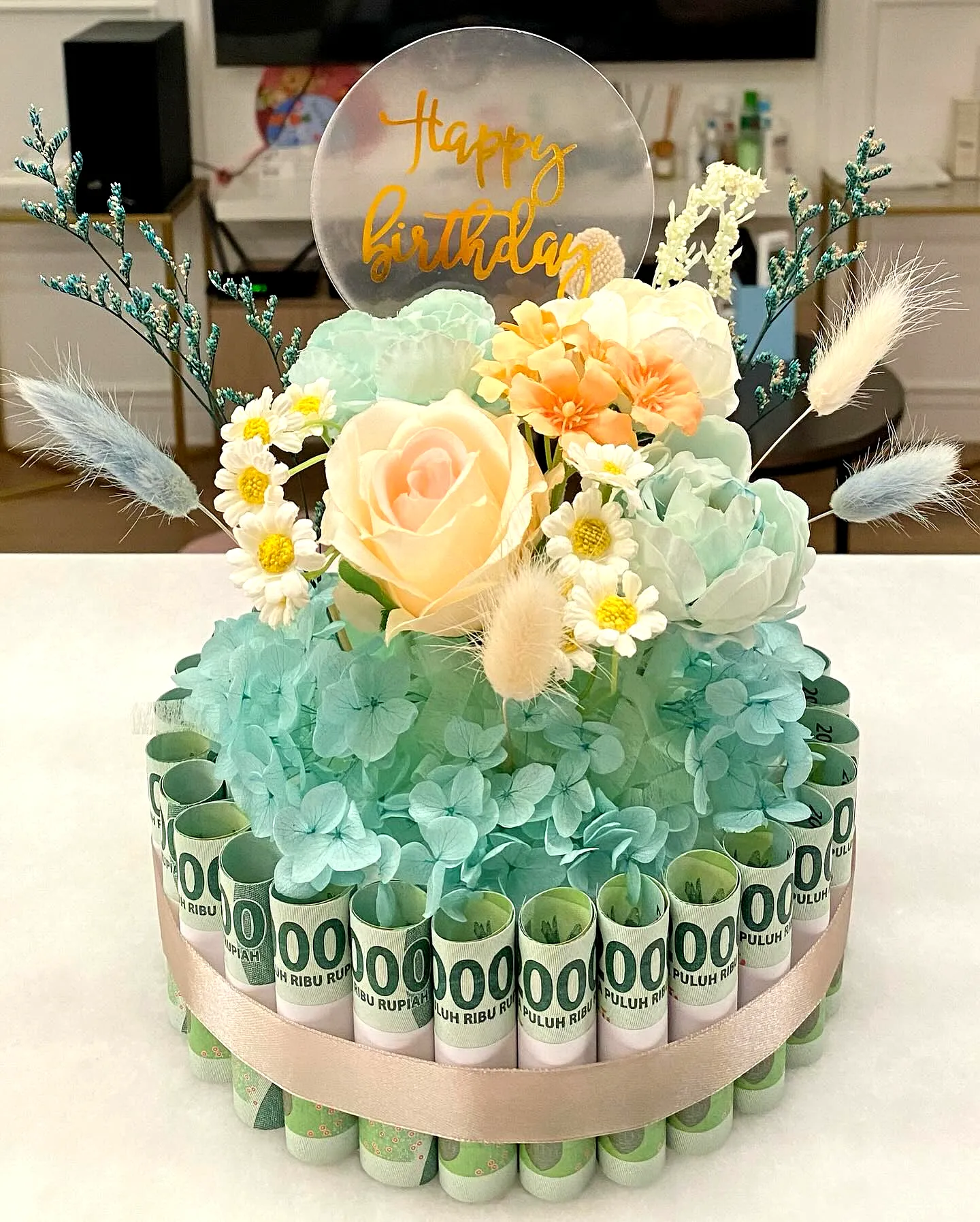 Creative Graduation Money Cake Design with Whimsical Floral Elements