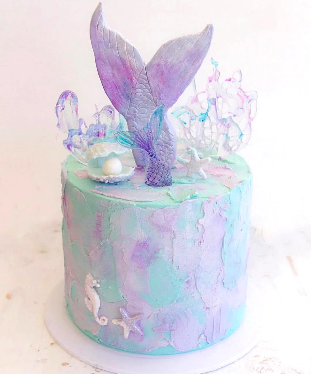 Creative Mermaid Cake Design with Ombre Pastel Colors and Adorable Decor