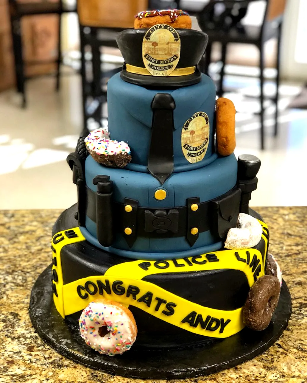 Creative Police Academy Graduation Cake Design with Fun Decorations