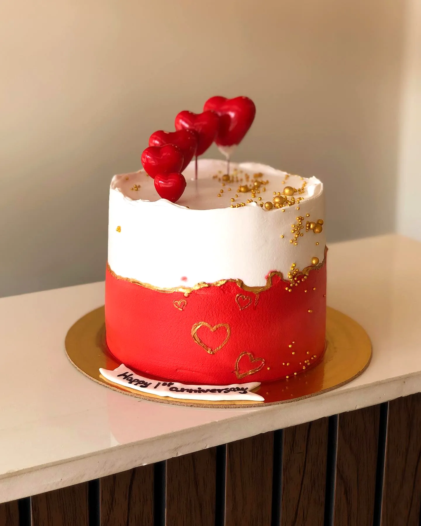 Creative red birthday cake design with charming decorations and smooth frosting