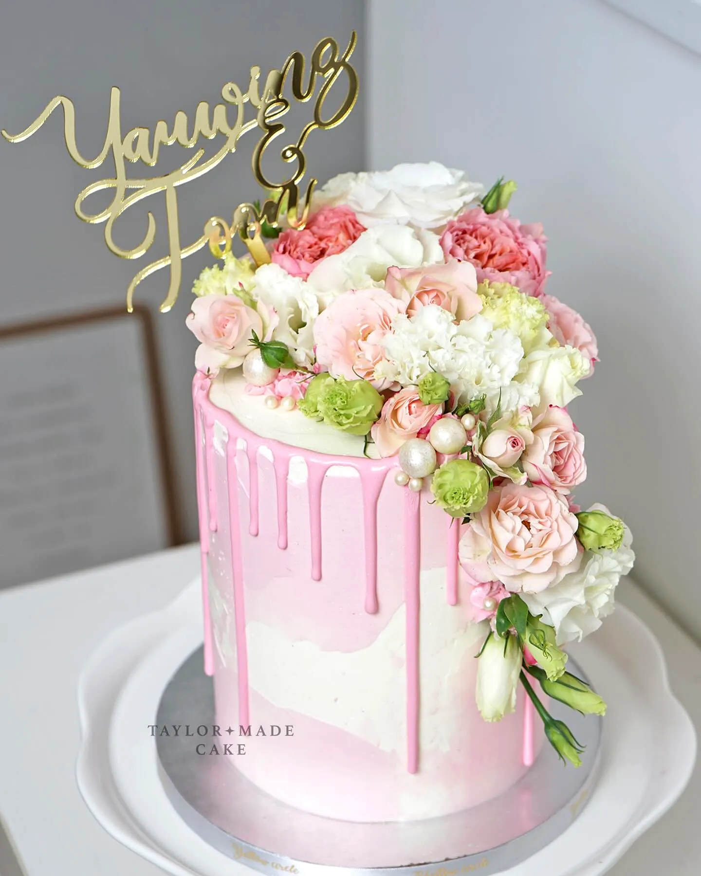 Creative small wedding cake design with modern pink ombre and fresh flowers