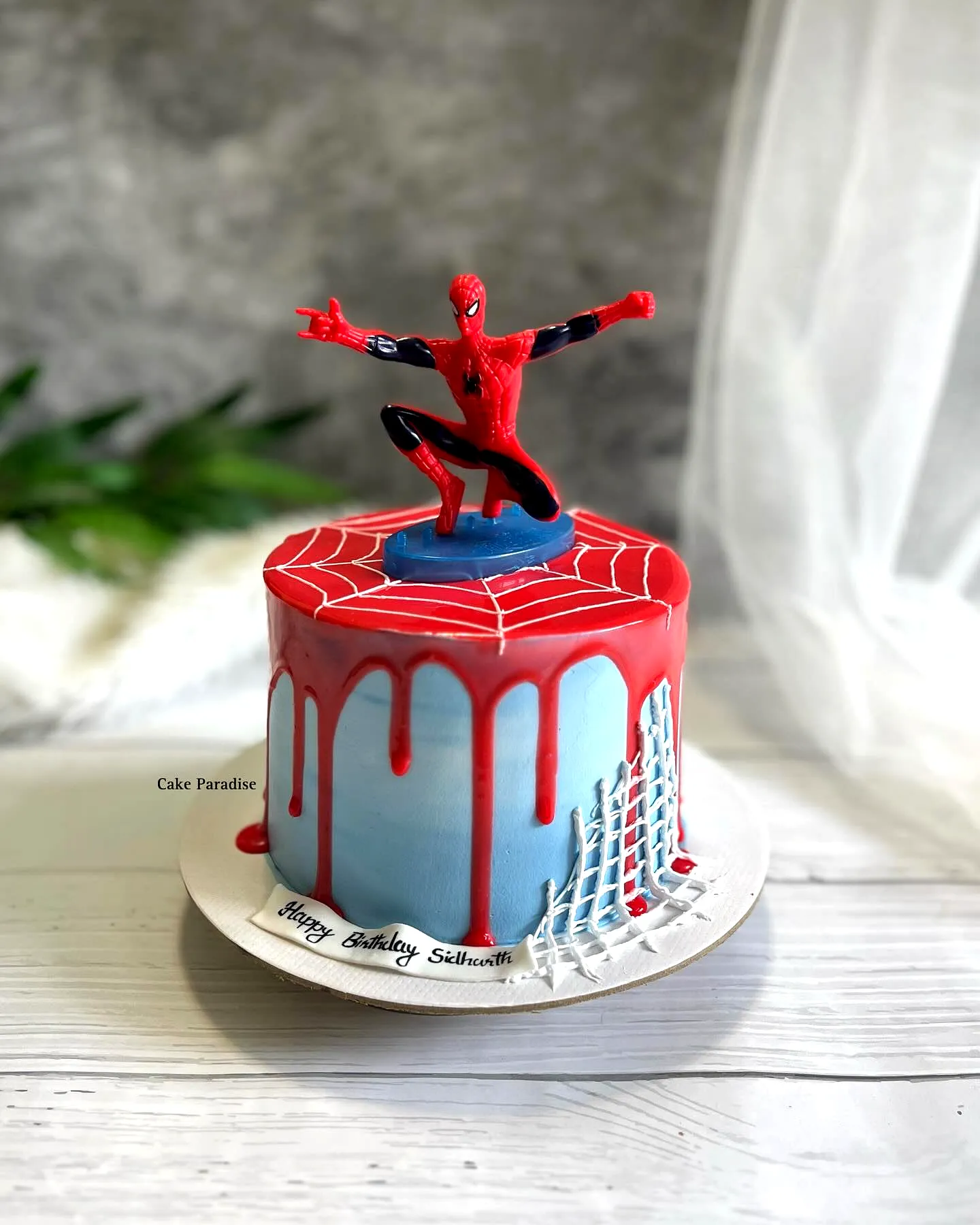 Creative Spiderman Birthday Cake Design with Vibrant Colors and Fun Decorations