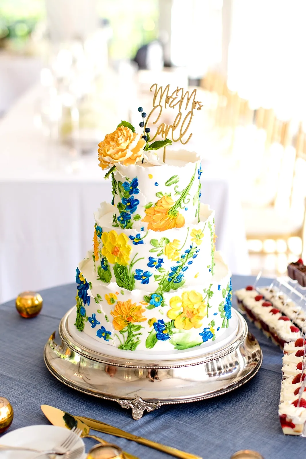Creative Summer Wedding Cake with Vibrant Floral Buttercream Design