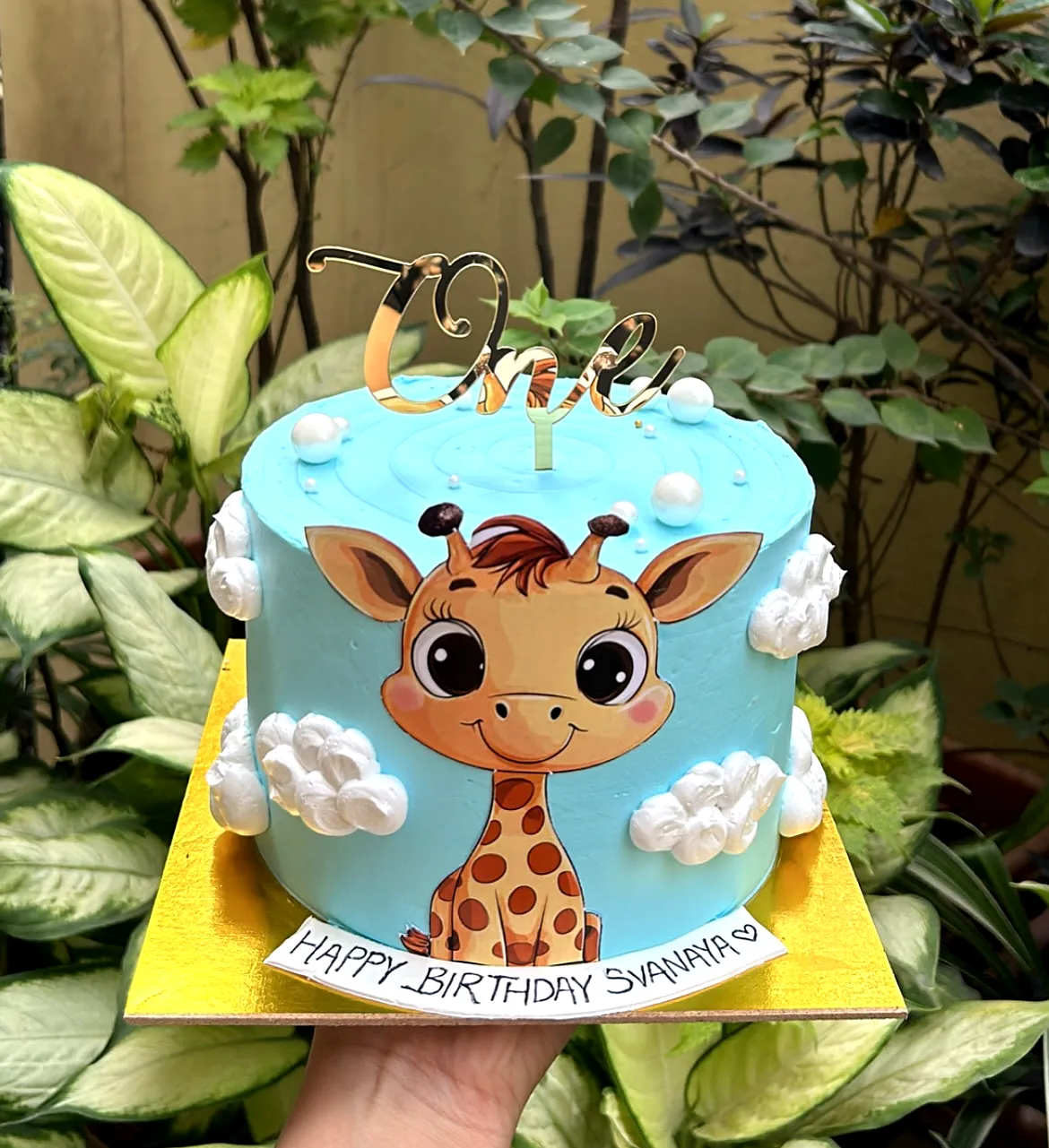 Cute 1st Birthday Cake with Giraffe Design and Blue Frosting