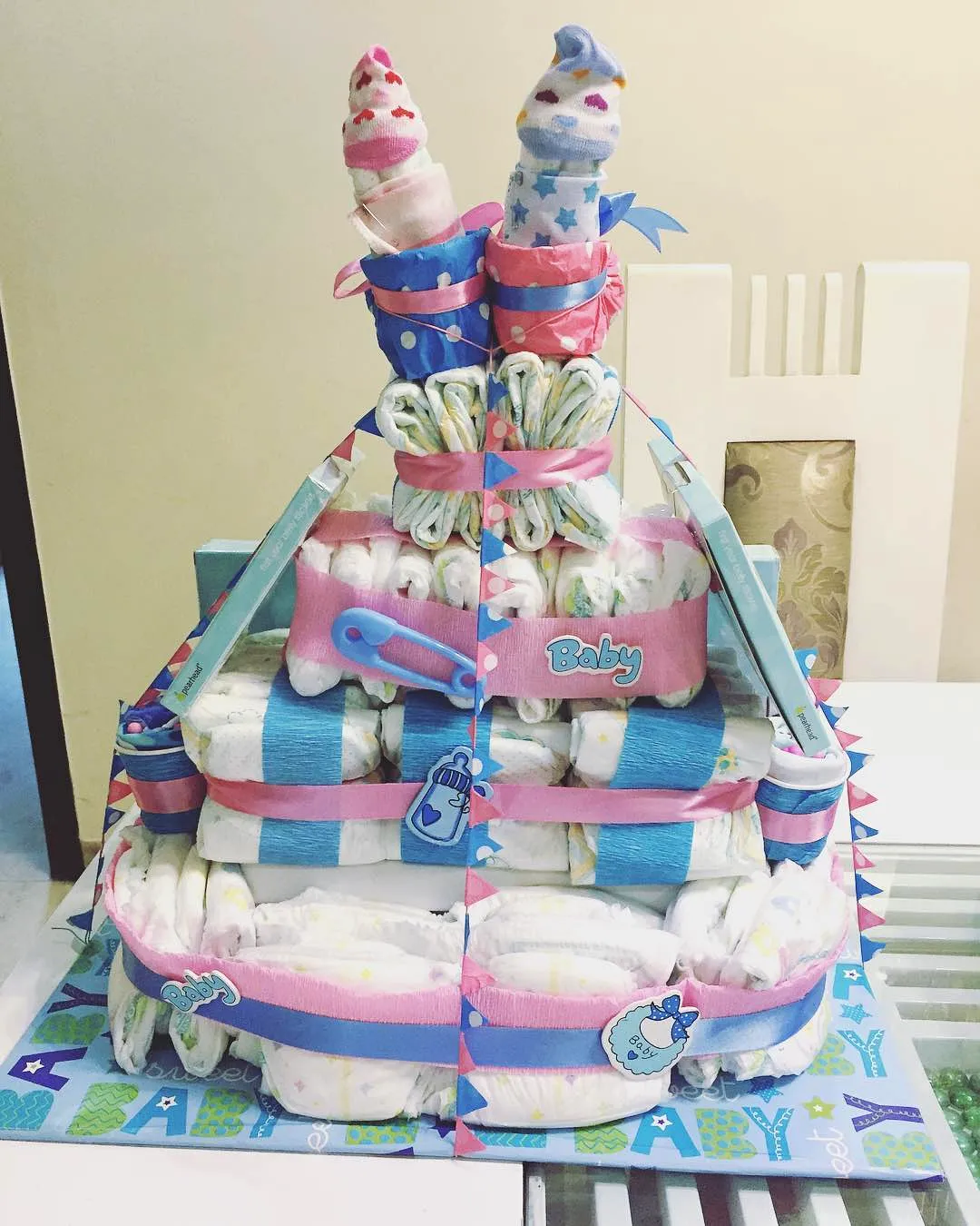 Cute and Colorful Diaper Cake Design for Your Baby Shower Celebration