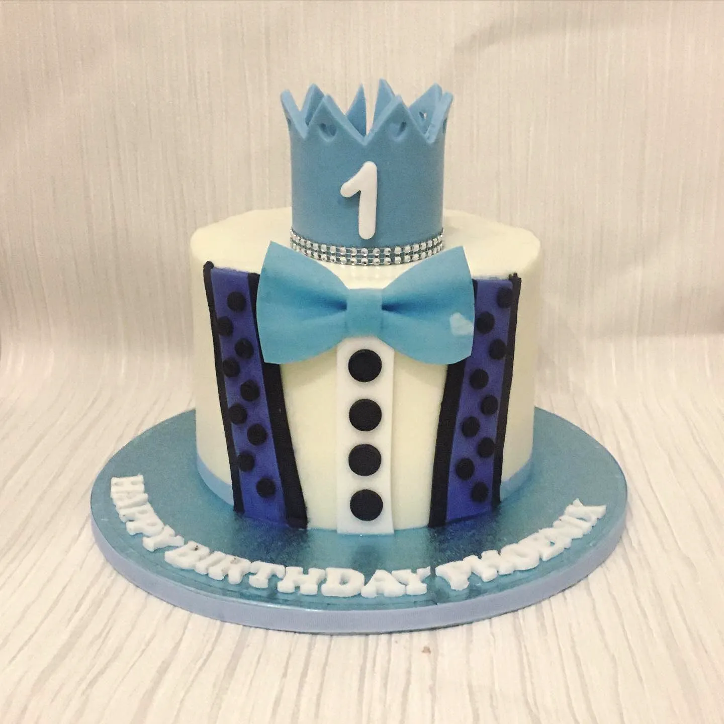 Cute and Creative 1st Birthday Cake Design in Whimsical Blue and Black