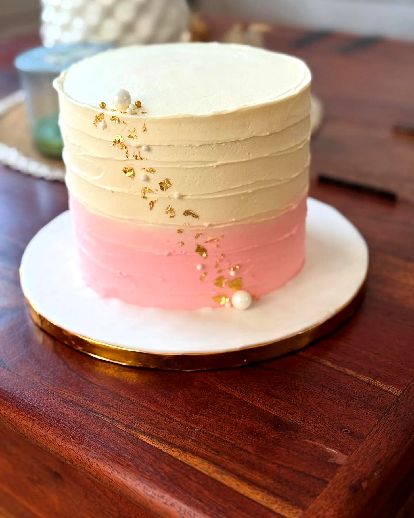 Cute and Elegant Birthday Cake with Smooth Frosting and Gold Accents
