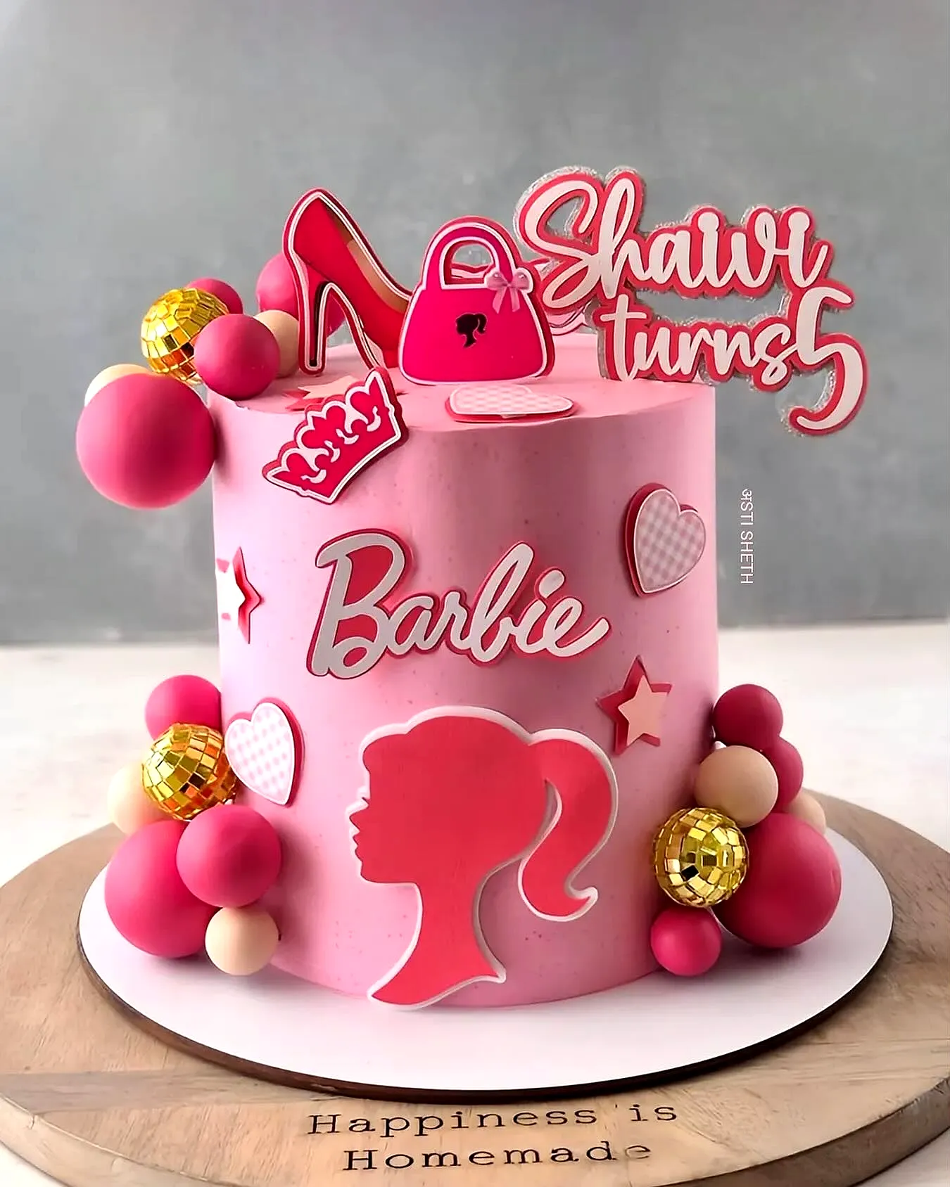 Cute Barbie Birthday Cake Design with Colorful Decorations and Fondant Accents