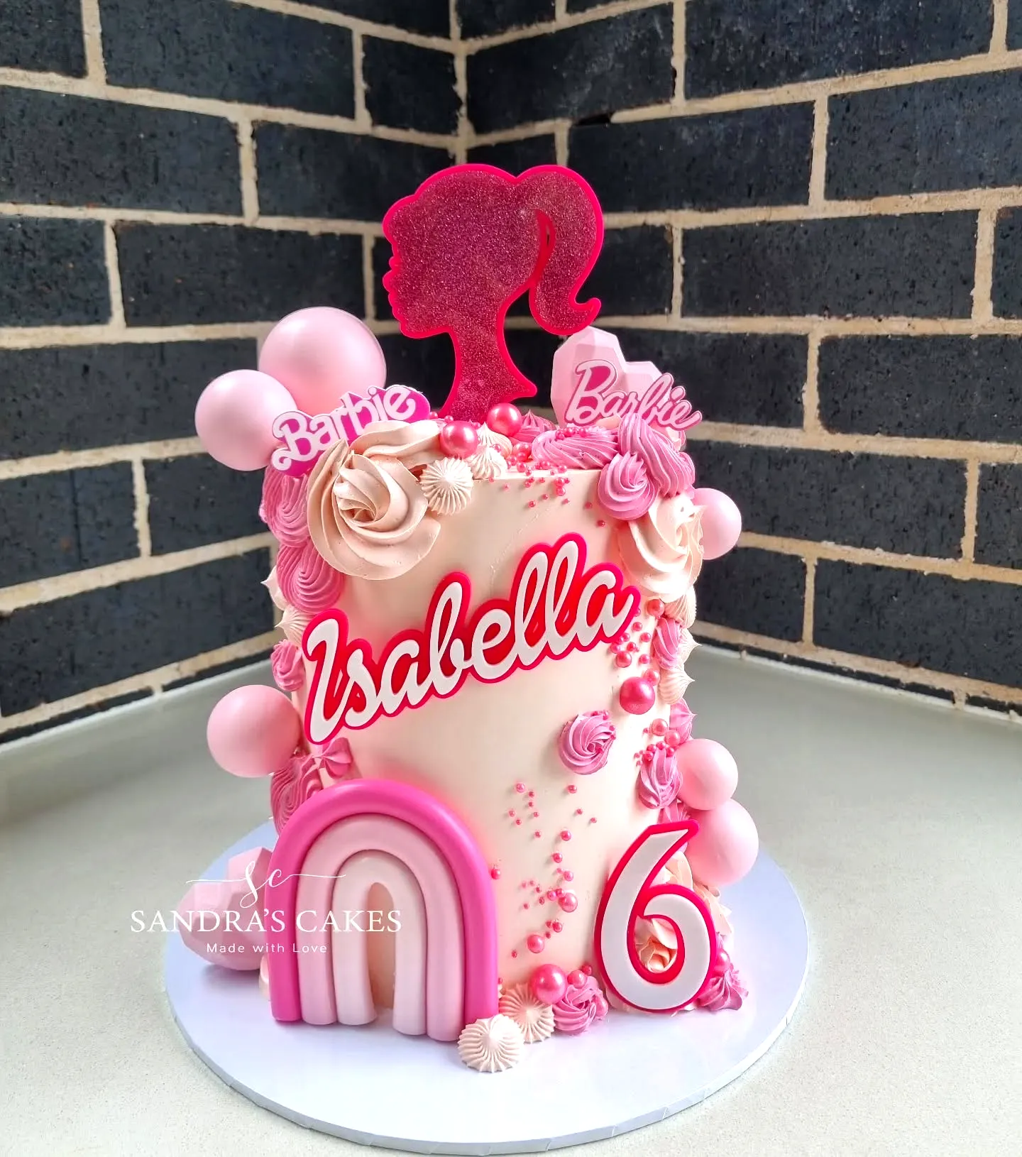 Cute Barbie Birthday Cake Design with Pink Buttercream and Fun Decorations