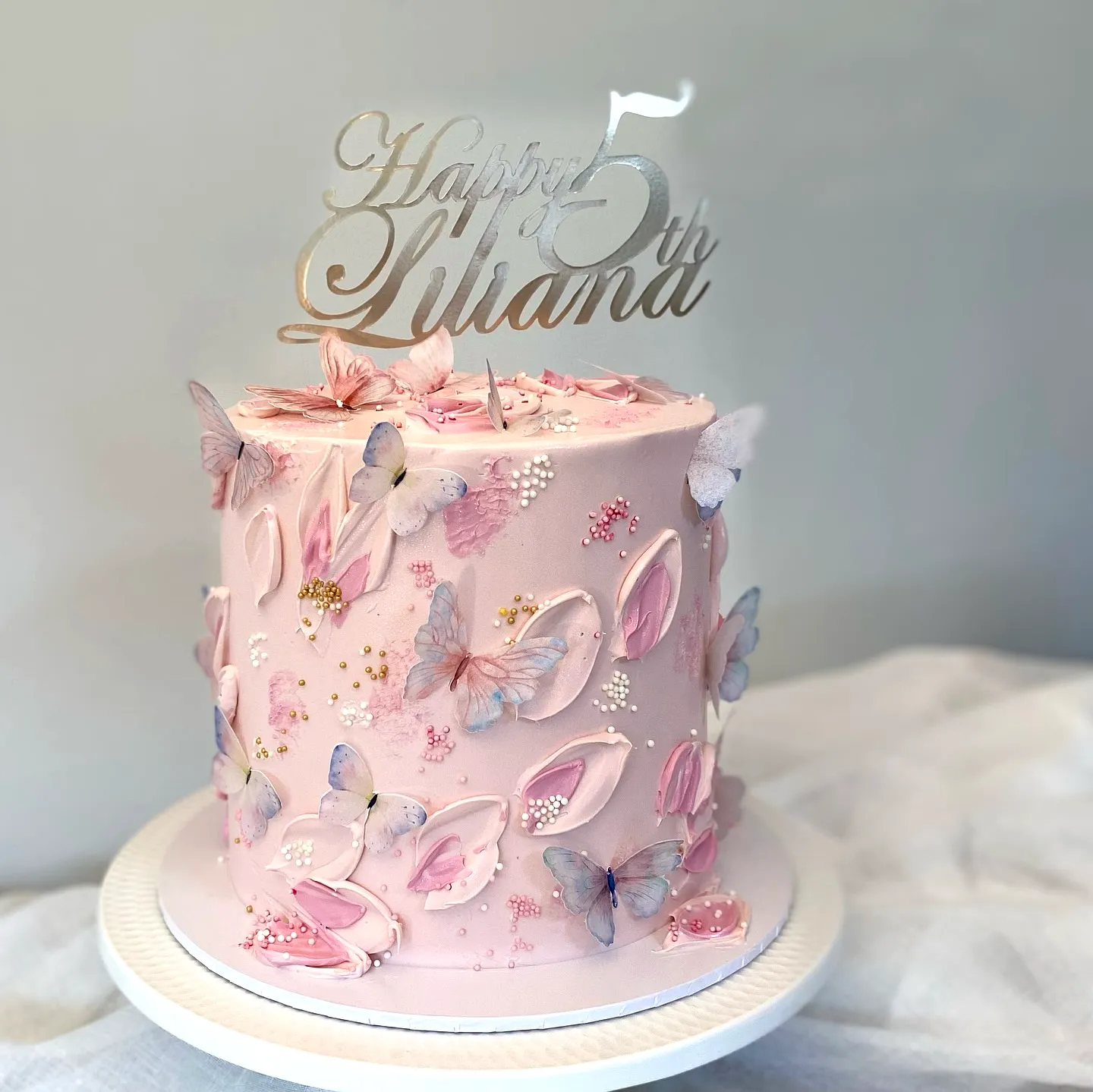 Cute butterfly birthday cake design in delightful pastel colors