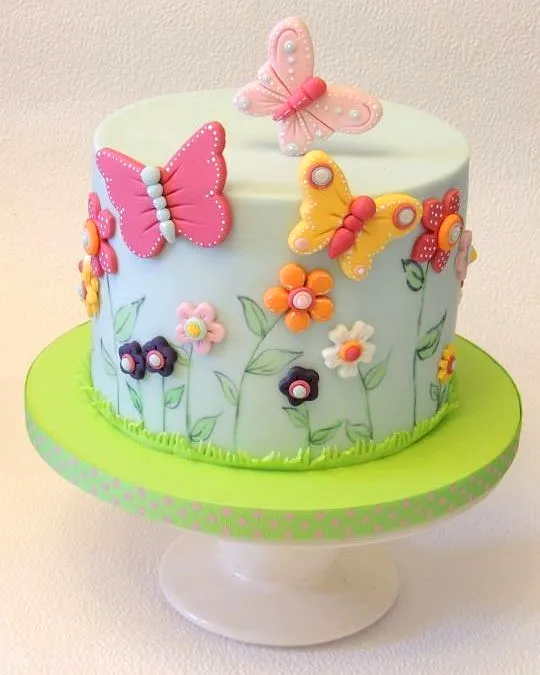 Cute butterfly birthday cake design with pastel colors and fun decorations