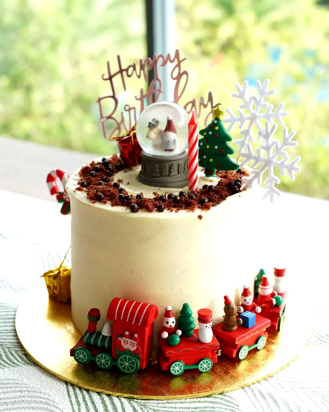 Cute Christmas Birthday Cake with Fun Train and Festive Decorations