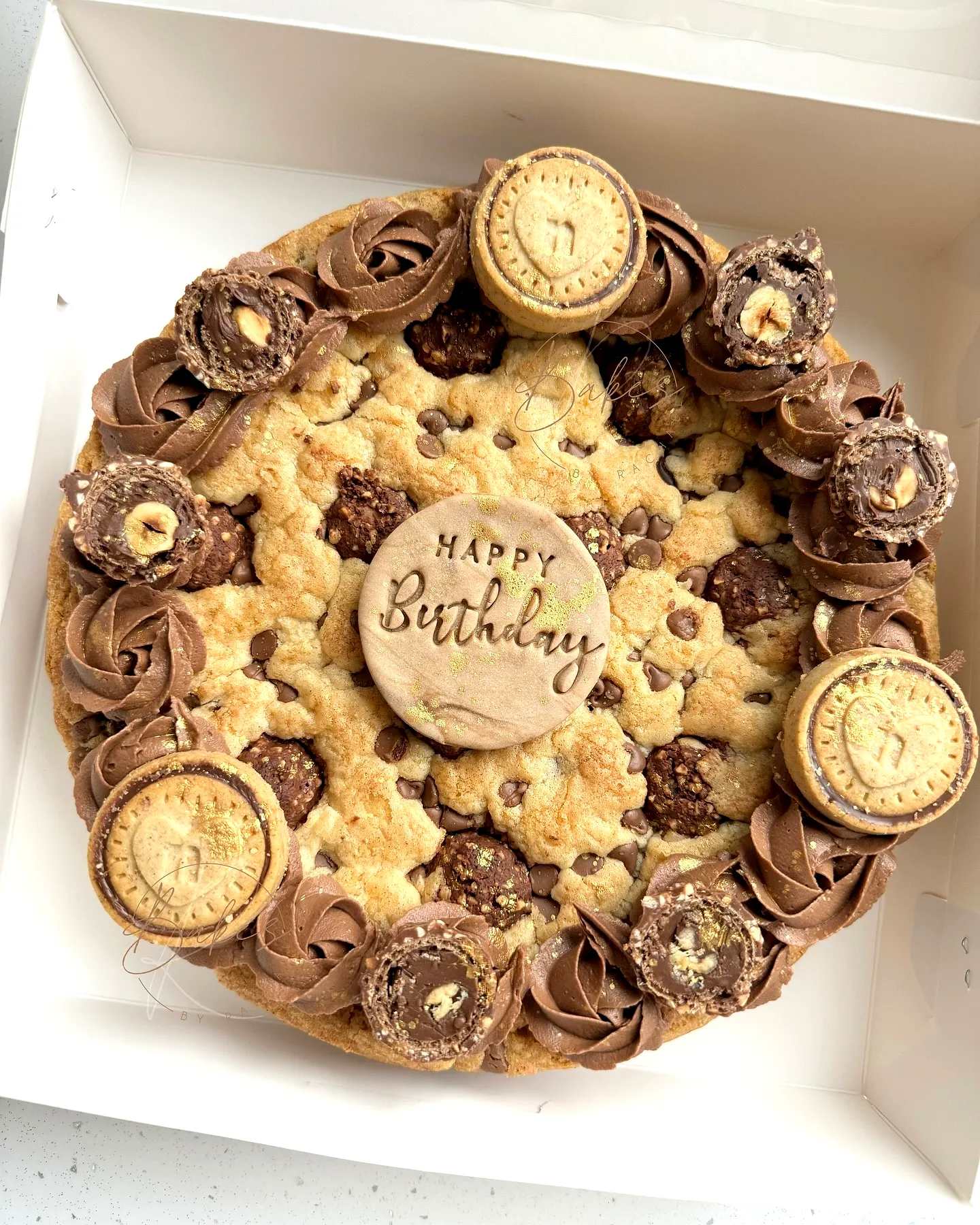 Cute cookie cake birthday inspiration with chocolate frosting and fun decorations