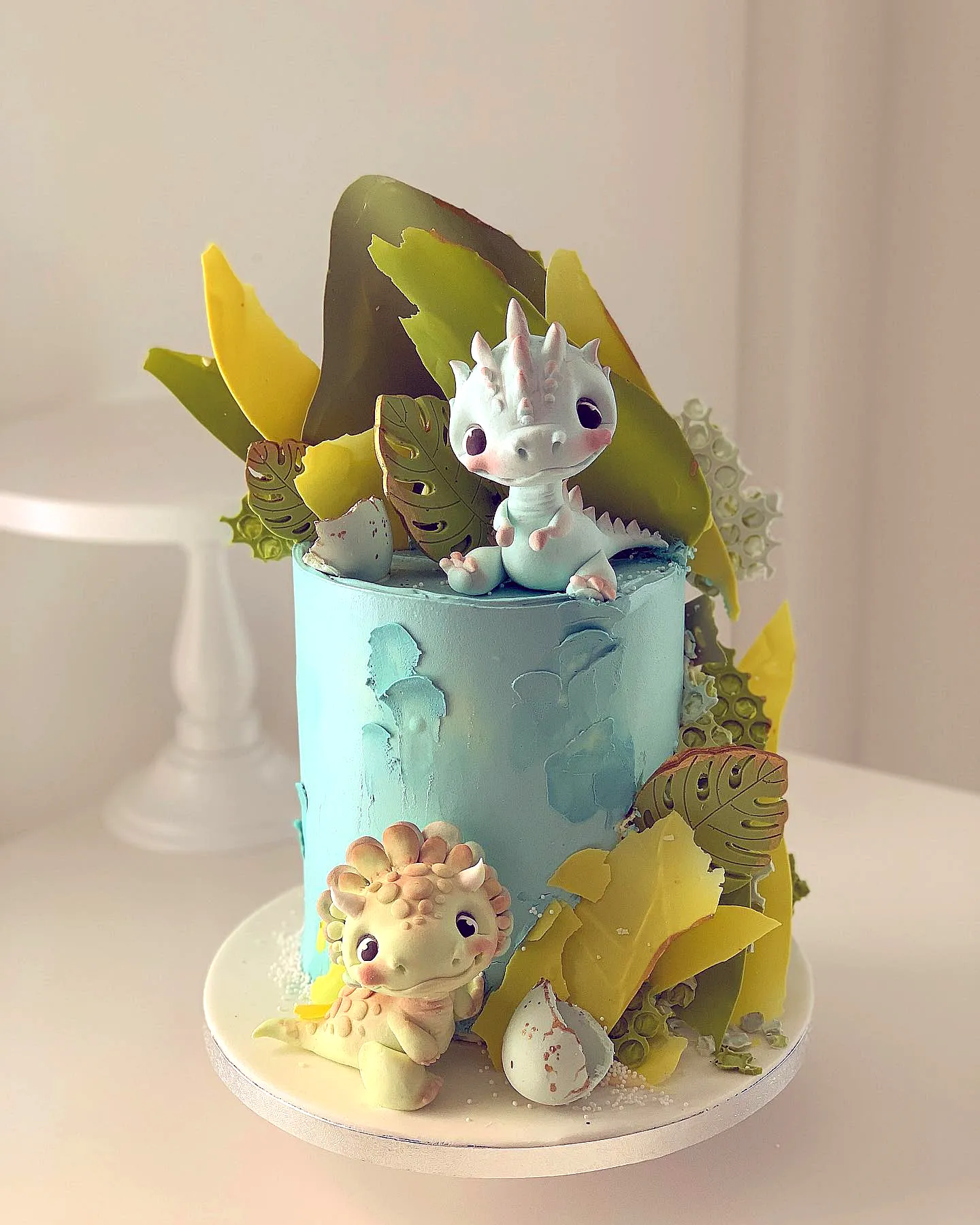 Cute dinosaur birthday cake design with colorful buttercream and fun decorations