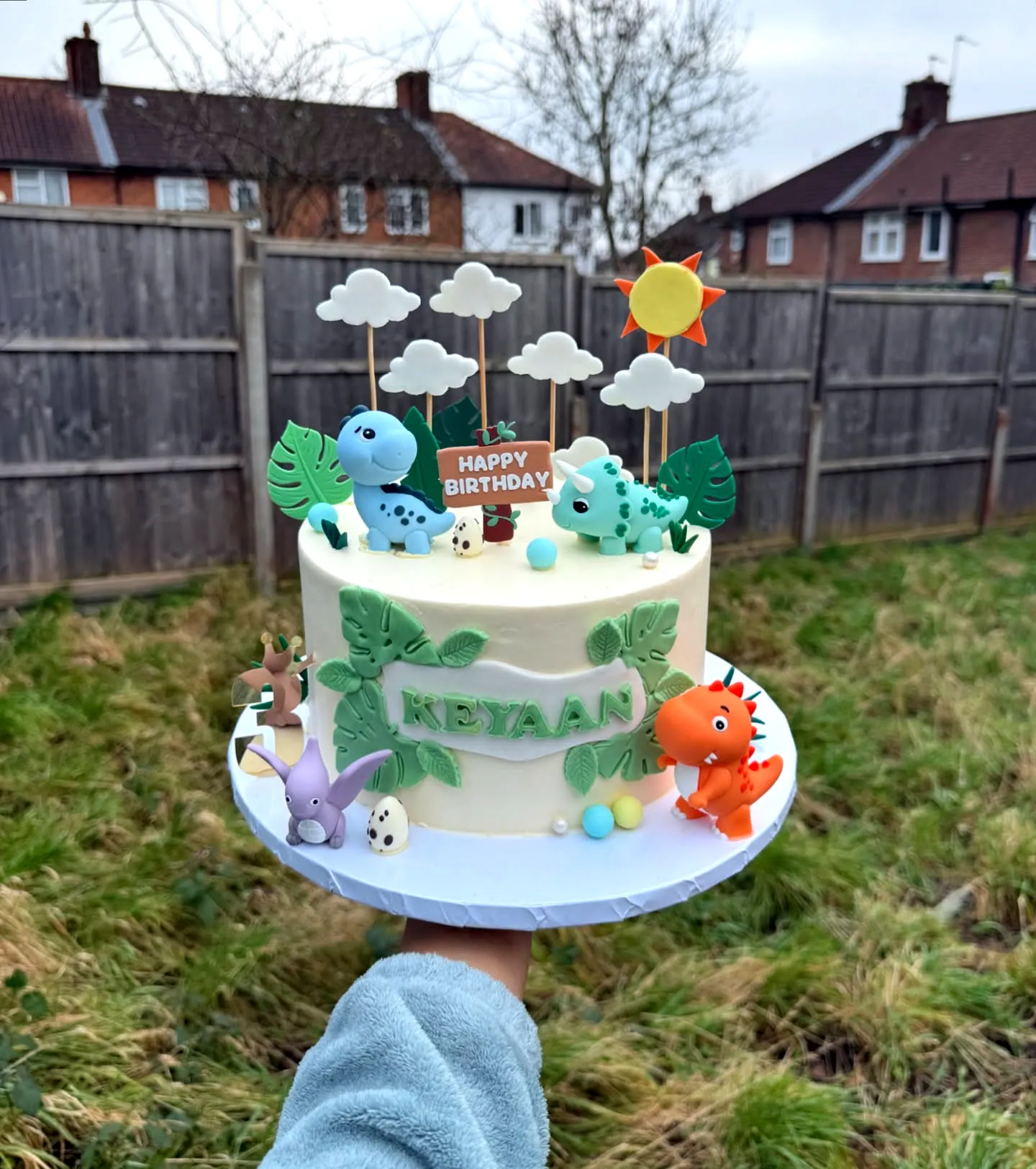 Cute dinosaur birthday cake design with playful decorations and vibrant colors