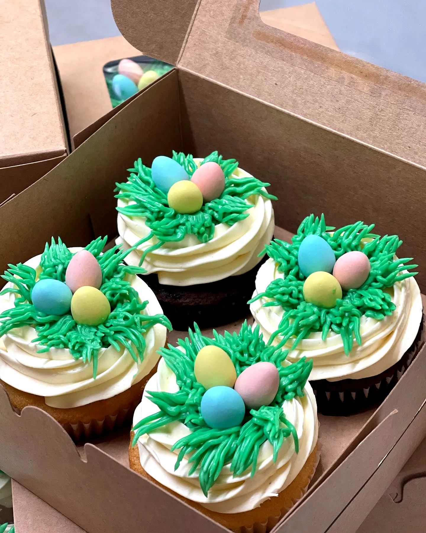 Cute Easter Cupcake Cake with Whimsical Bird Nest Design and Colorful Decorations