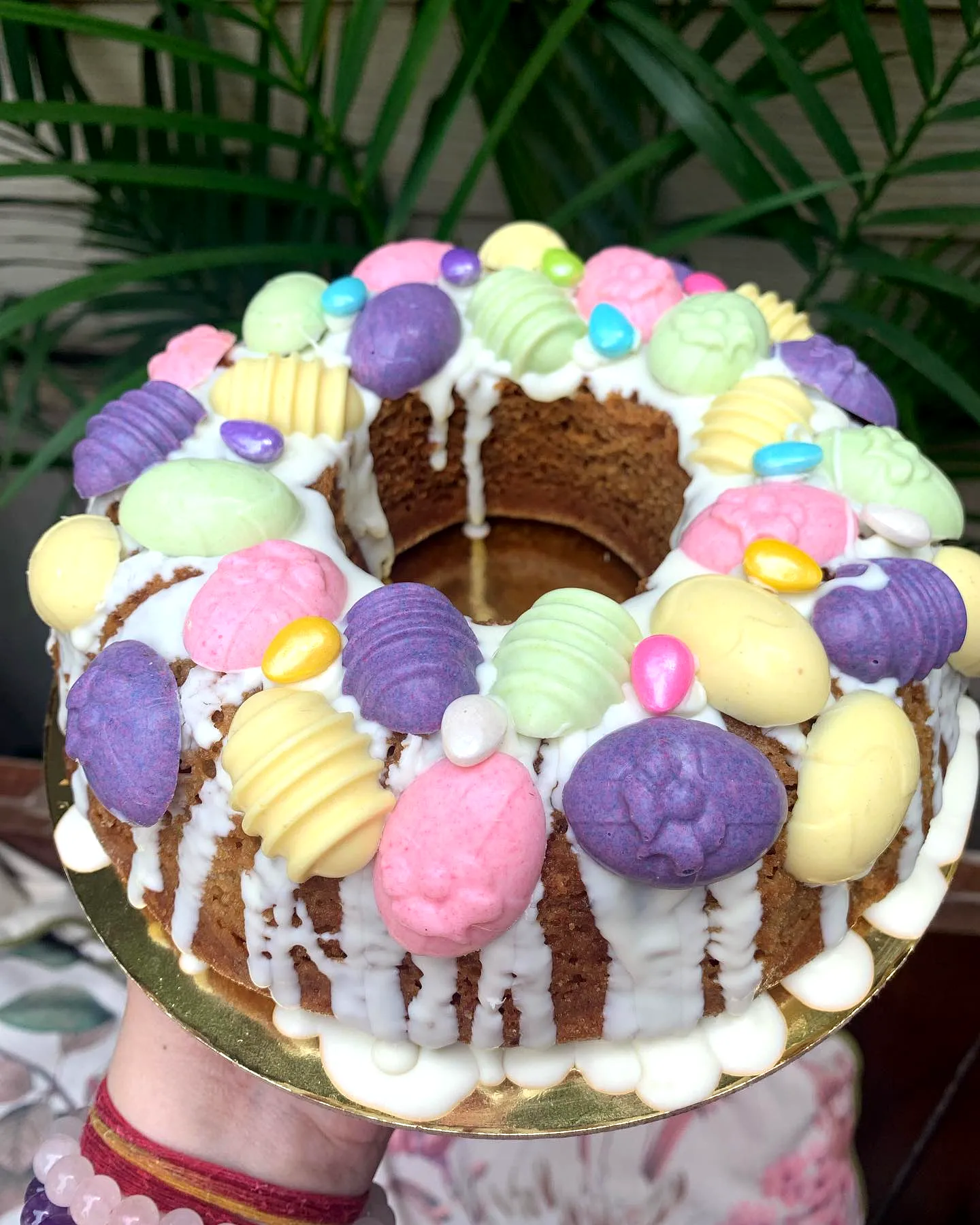 Cute Easter Egg Cake with Pastel Icing and Colorful Candy Decorations