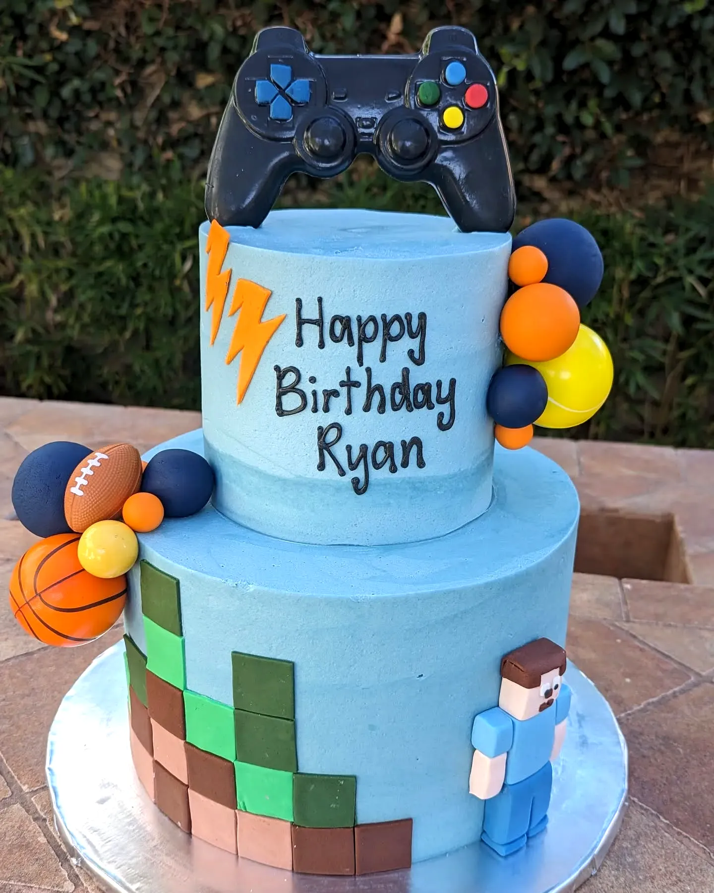 Cute gamer birthday cake design with a fun pixelated Minecraft theme