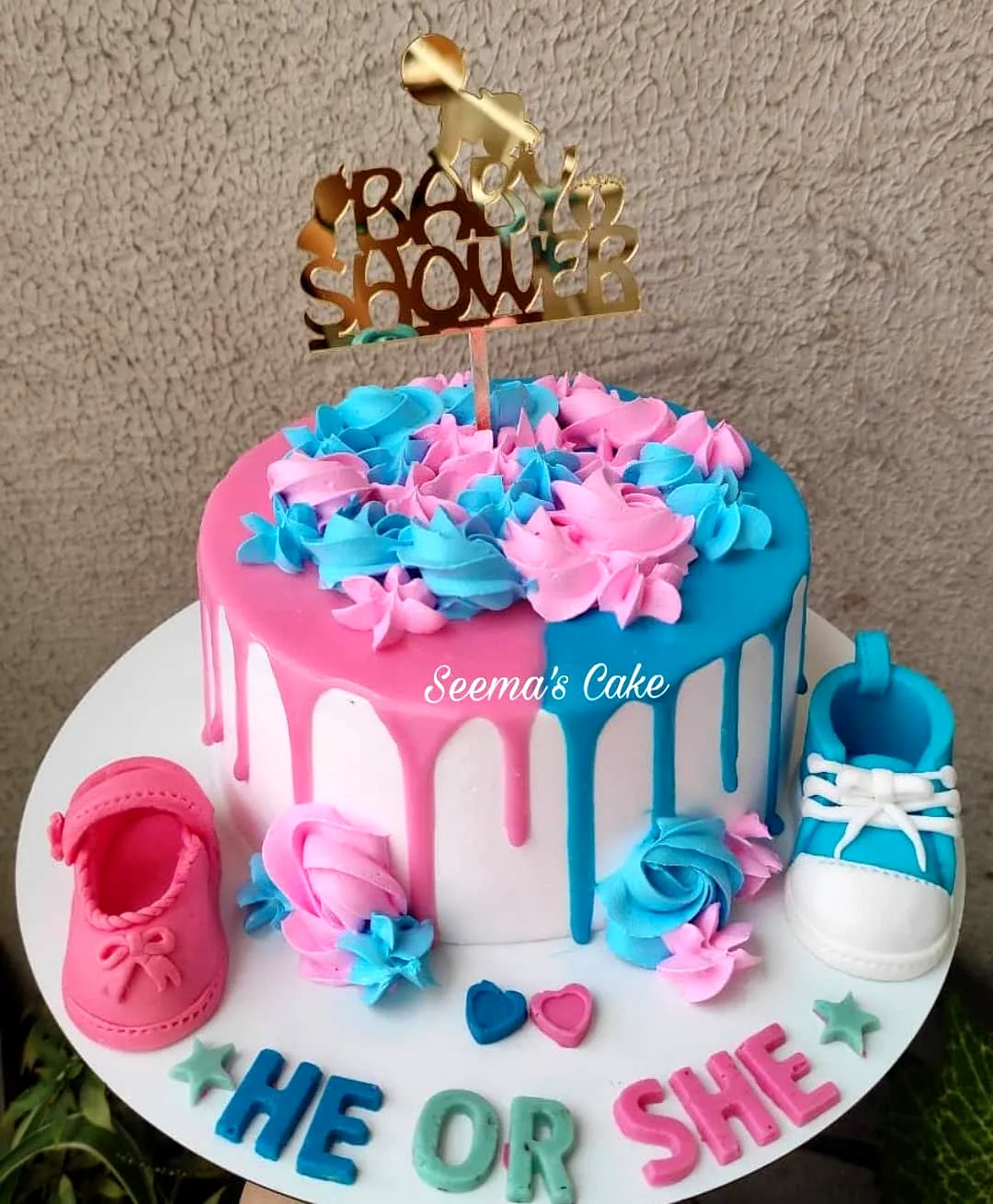 Cute Half Pink and Blue Baby Shower Cake Design with Drip and Rosettes