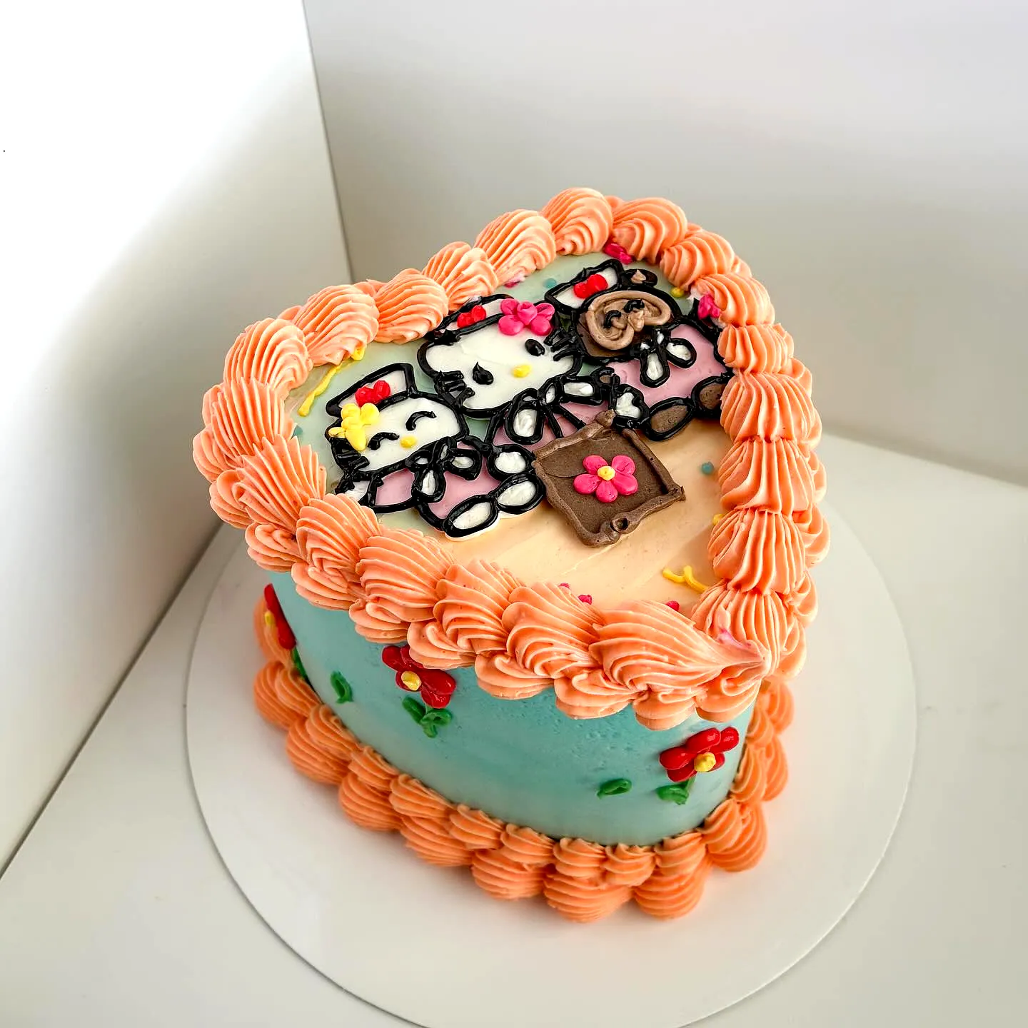Cute heart-shaped nurse graduation cake with colorful frosting and decor