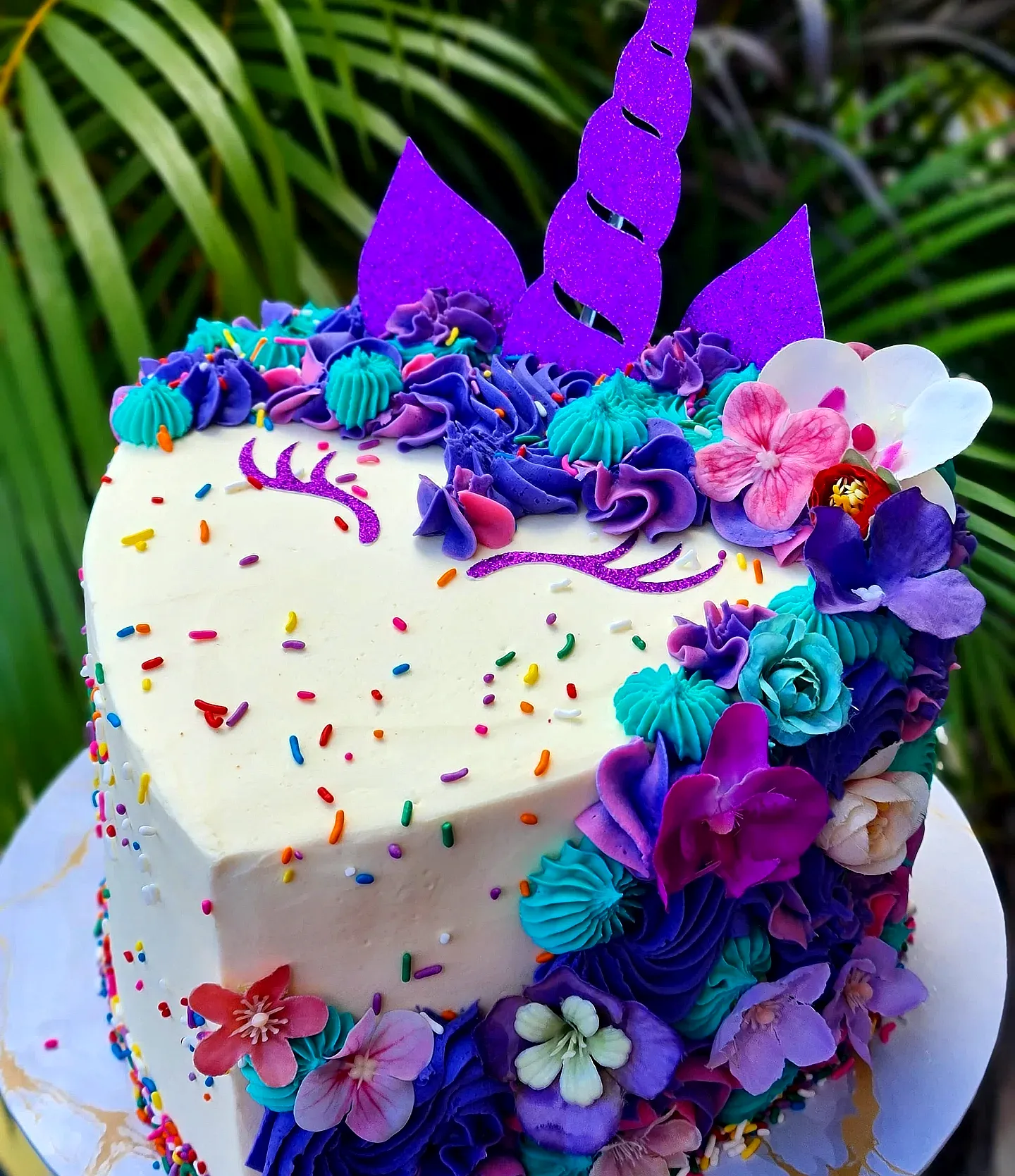 Cute Heart-Shaped Unicorn Birthday Cake with Colorful Buttercream Design