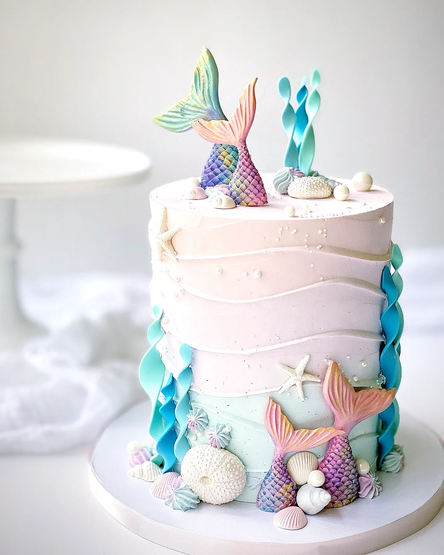 Cute mermaid birthday cake design with vibrant colors and playful decorations