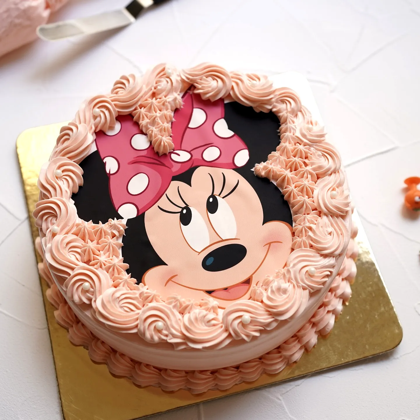 Cute Minnie Mouse Birthday Cake Design with Pink Polka Dots and Buttercream