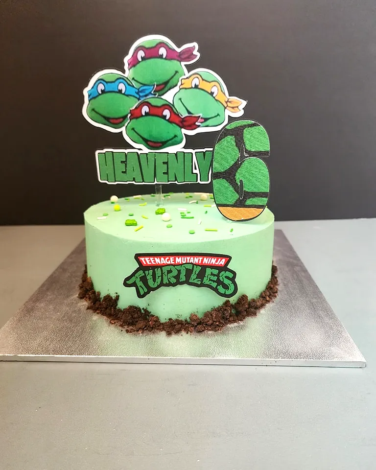 Cute mint green ninja turtle birthday cake design for a fun celebration