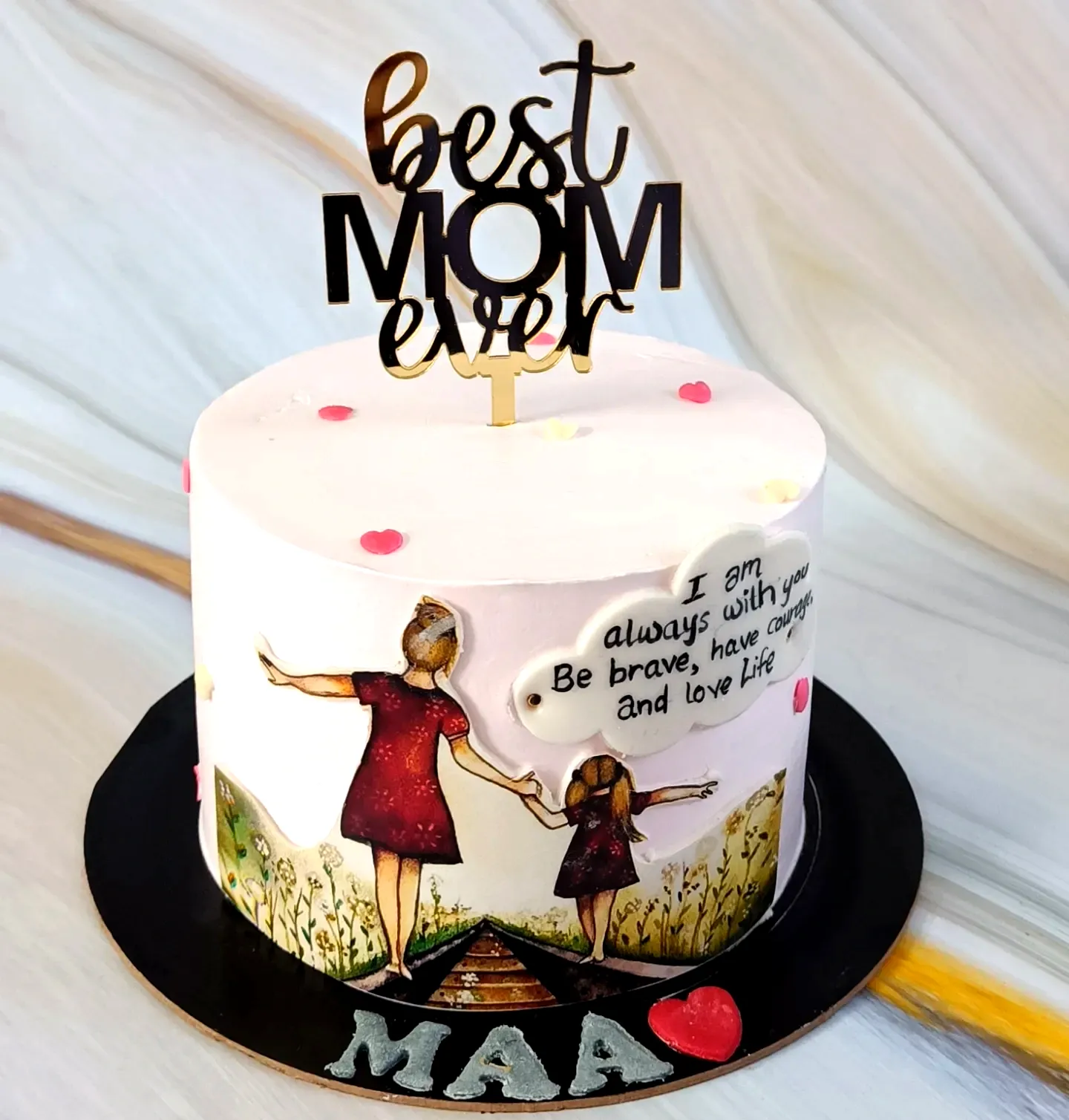 Cute mother birthday cake design in soft pink with whimsical decorations