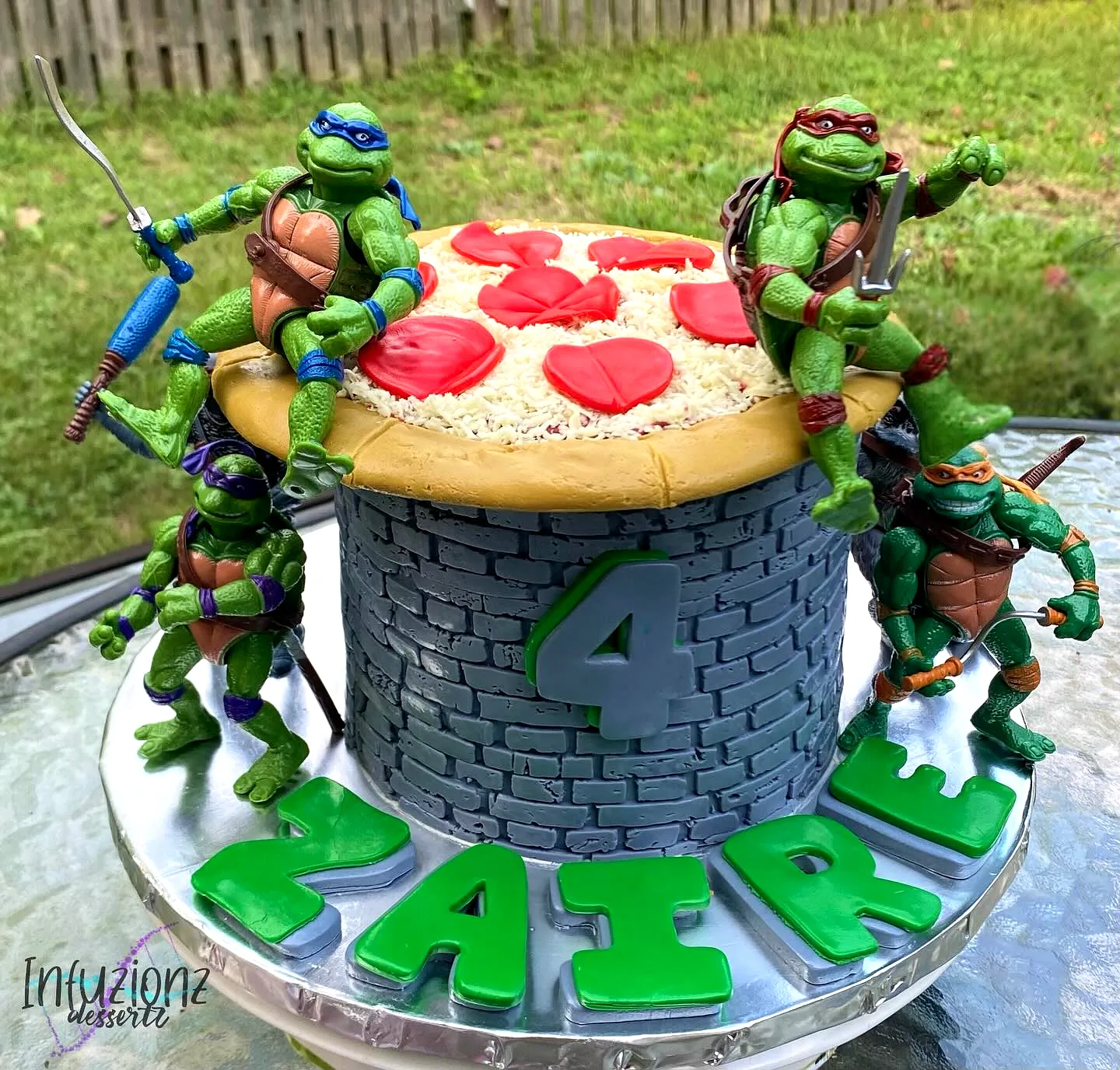 Cute Ninja Turtle Birthday Cake with Colorful Pizza and Fun Decorations