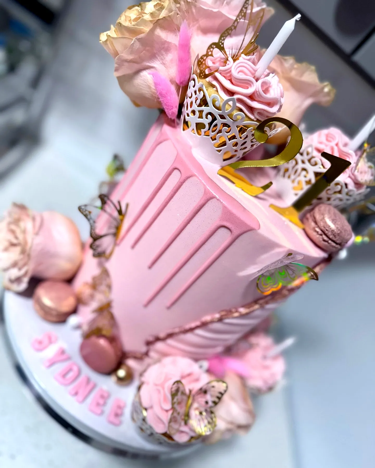 Cute pink drip cake for 21st birthday celebration
