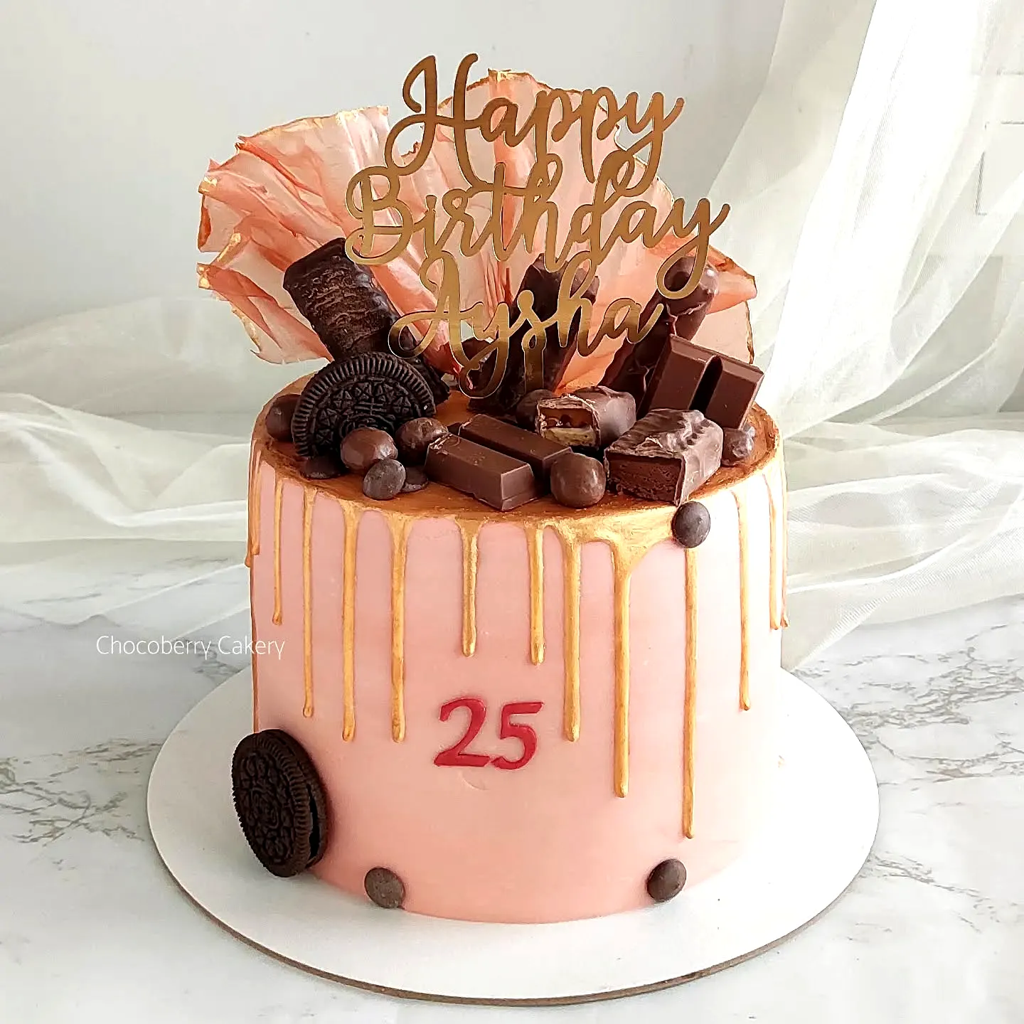 Cute pink drip cake with shiny glaze for 25th birthday celebration