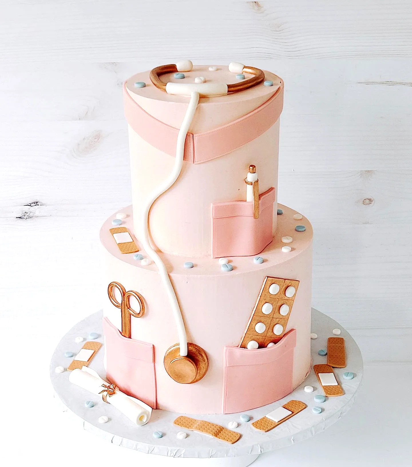Cute pink graduation cake for a medical celebration