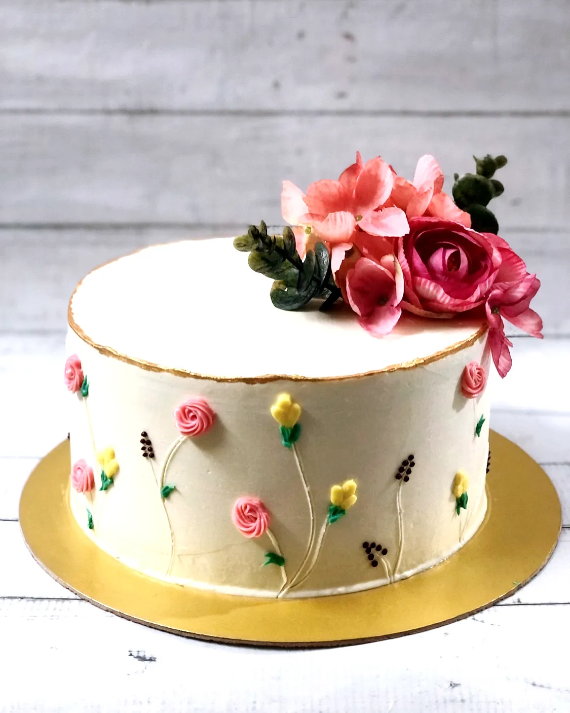 Cute simple birthday cake design with charming buttercream flowers