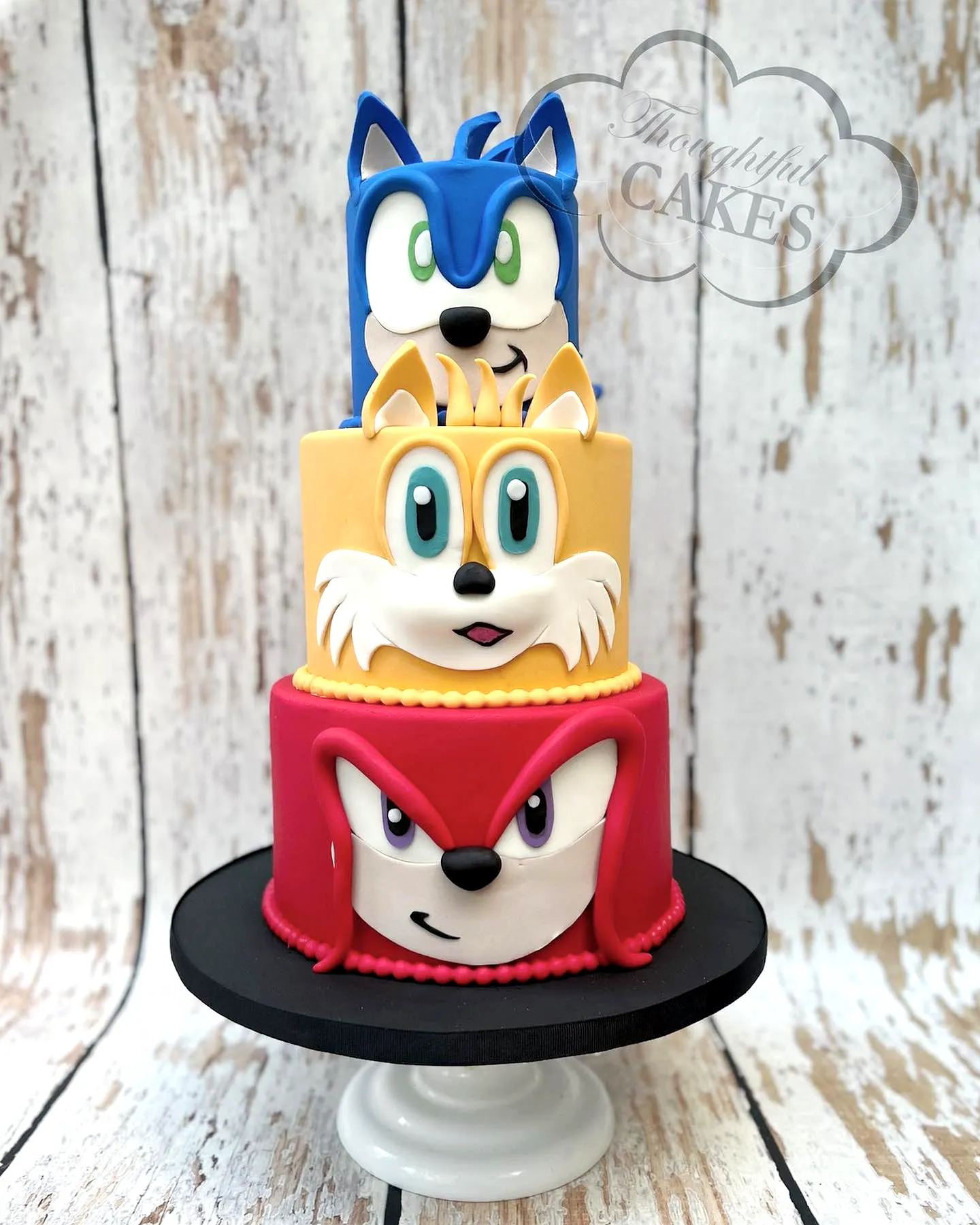Cute Sonic Birthday Cake Design with Colorful Tiers and Adorable Characters