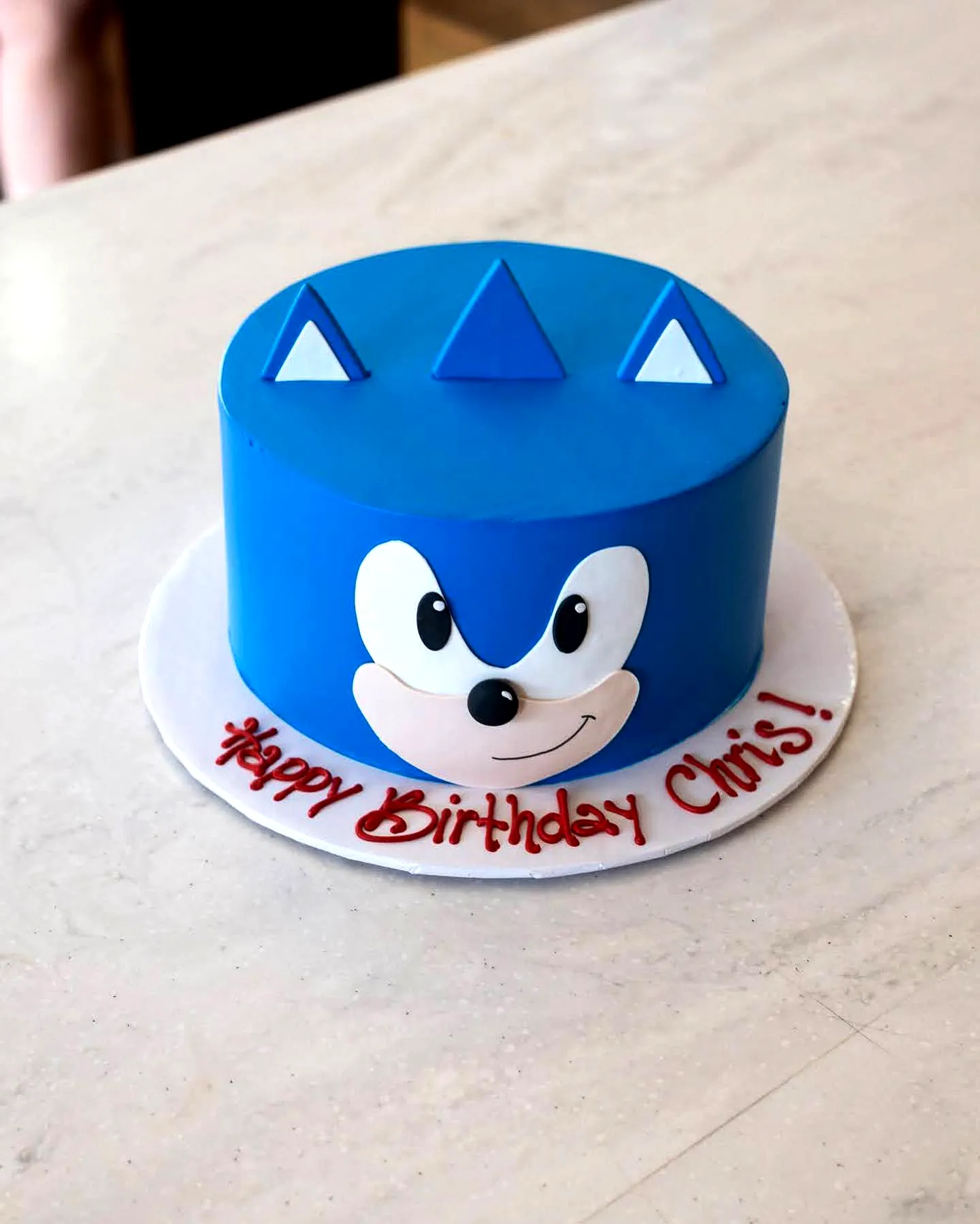 Cute Sonic Birthday Cake Design with Vibrant Blue Fondant and Happy Decor