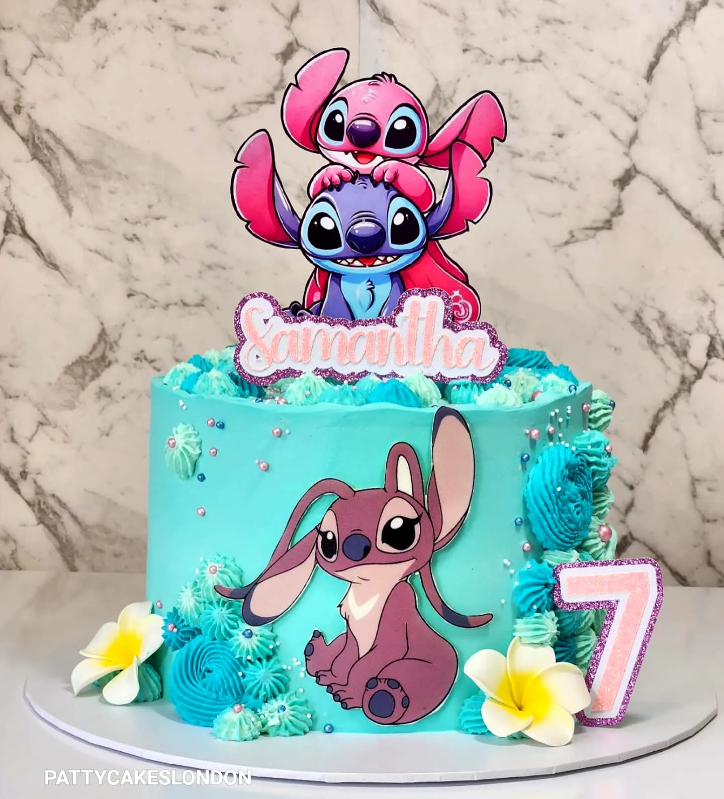 Cute Stitch Birthday Cake Design with Colorful Swirls and Fun Decorations