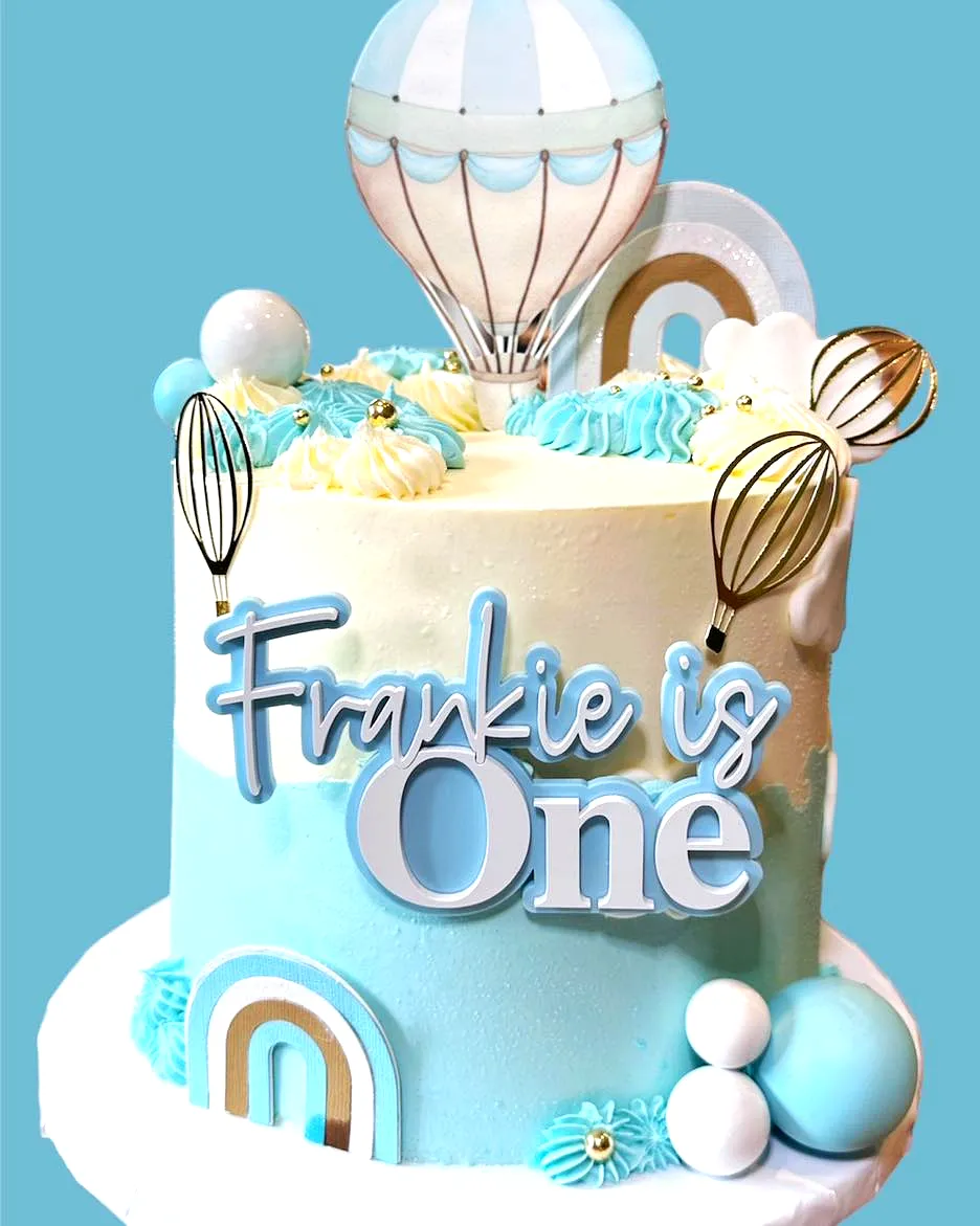 Cute Two-Tiered 1st Birthday Cake Design in Blue and White Pastel Theme