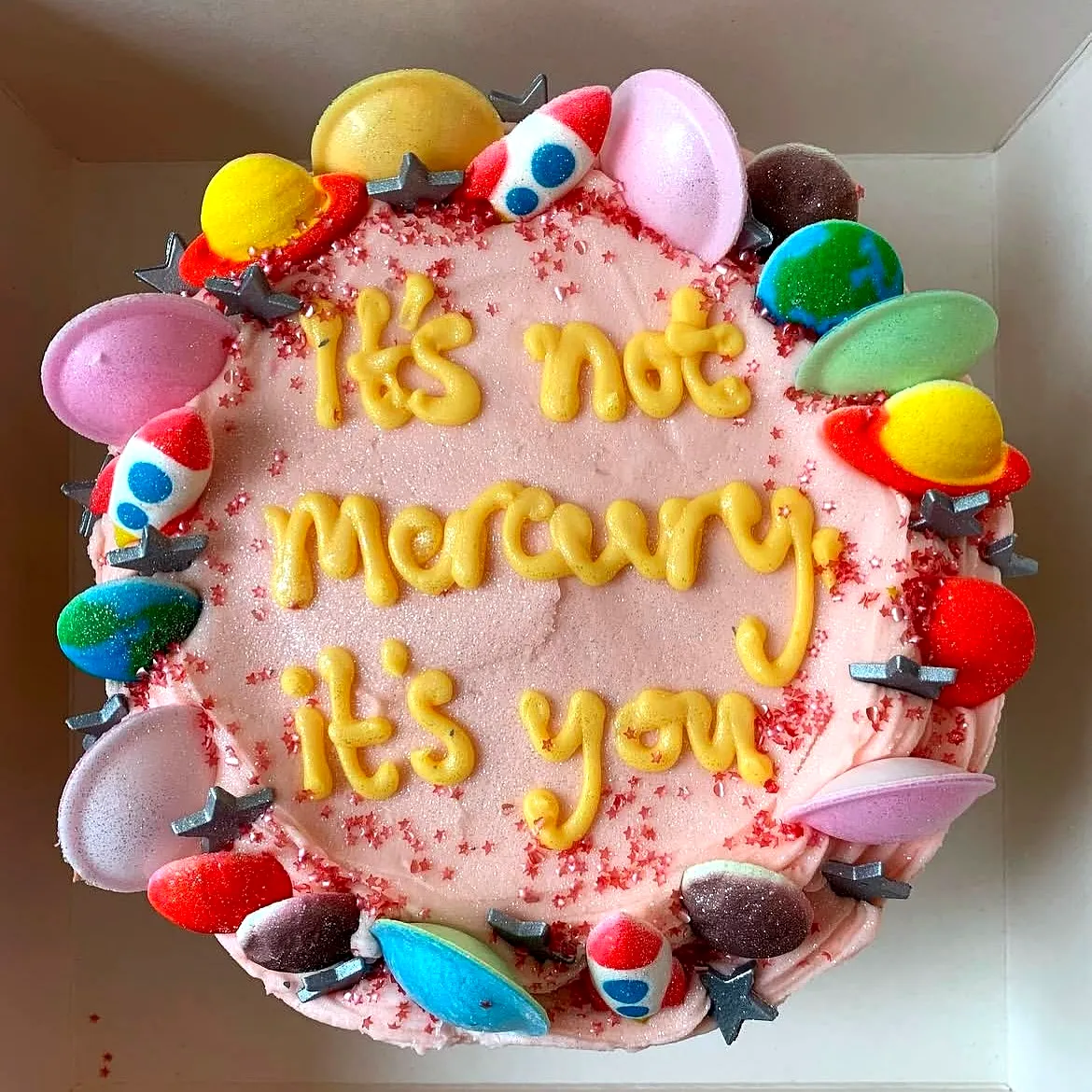 Delightful Funny Birthday Cake with Whimsical Space Theme and Pastel Frosting