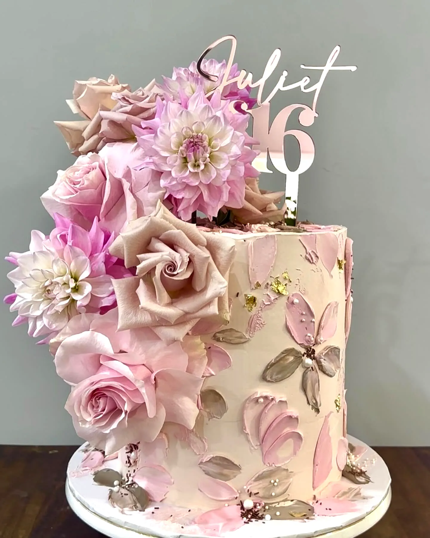 Elegant 16th Birthday Cake with Floral Design and Gold Accents