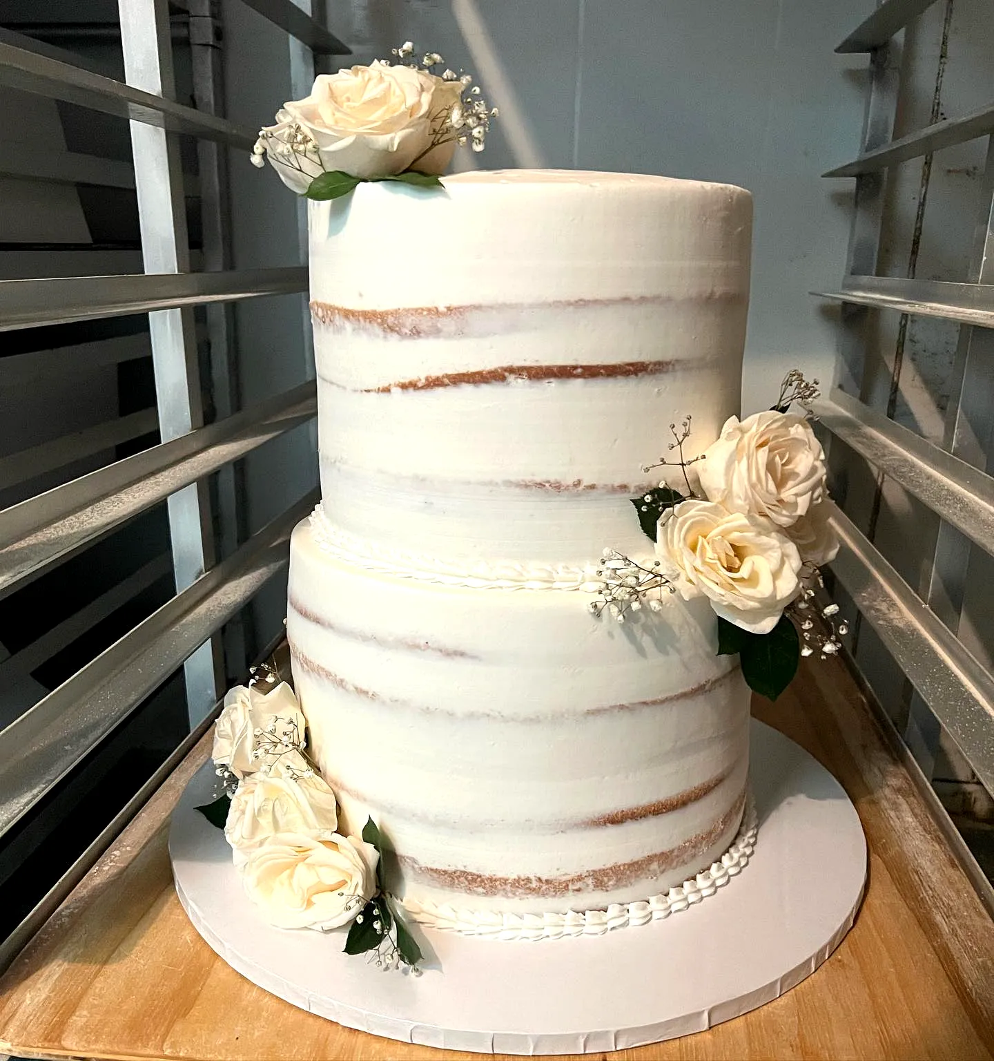 Elegant 2 Tier Wedding Cake Design with Delicate Roses and Buttercream Finish