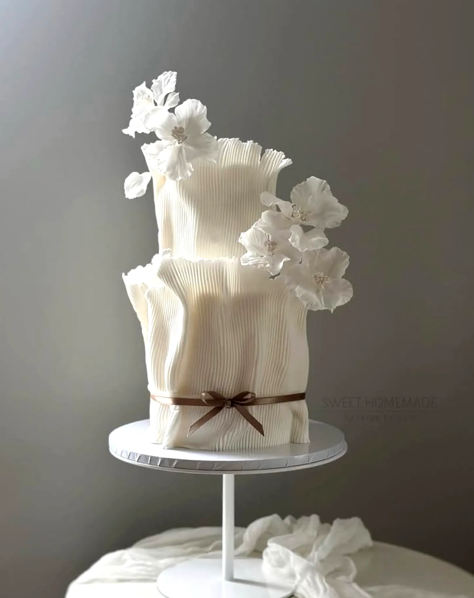 Elegant 2 Tier Wedding Cake Design with Ruffled Fondant and Sugar Flowers