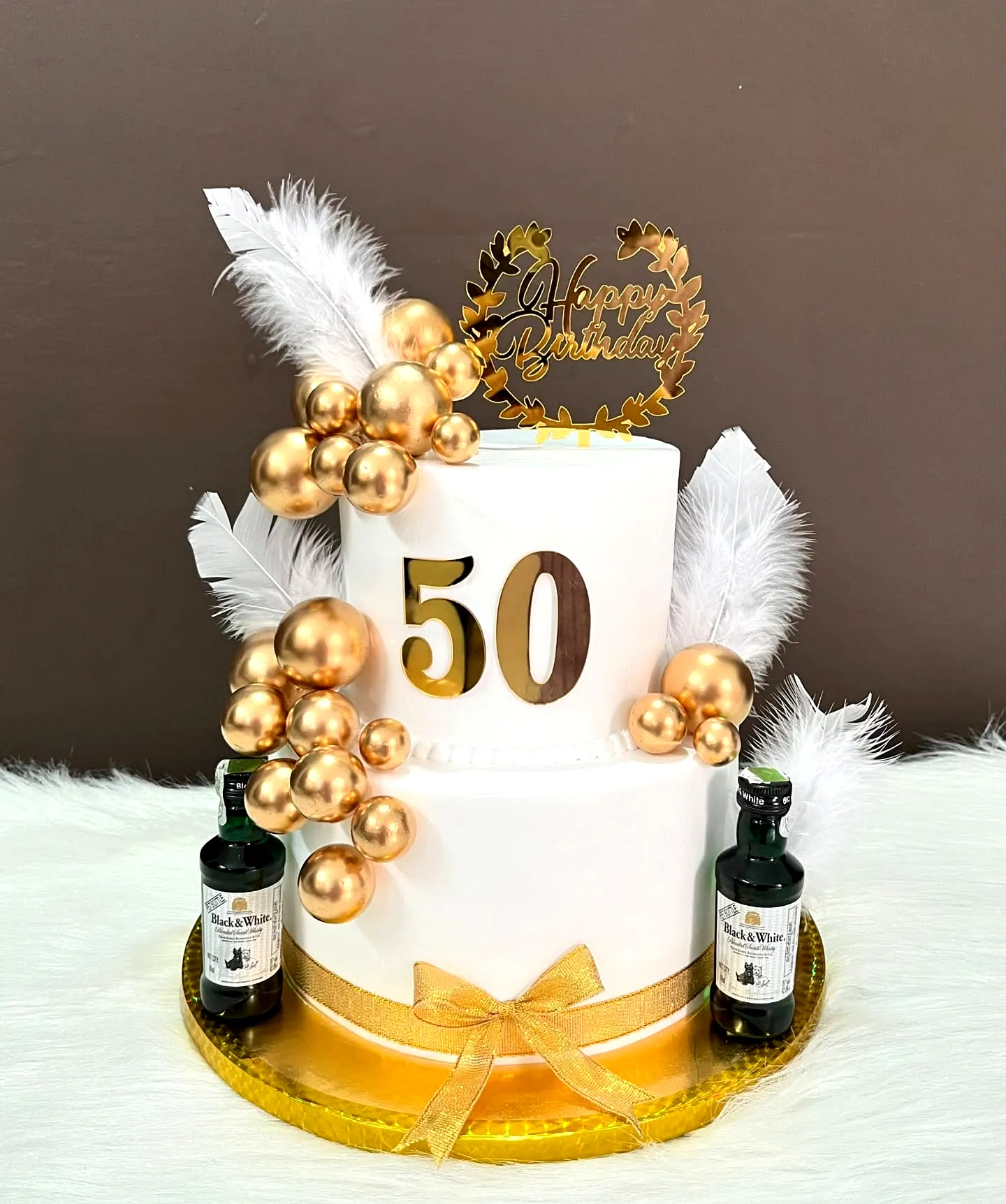 Elegant 50th Birthday Cake for Women with Gold Accents and Glossy Finish