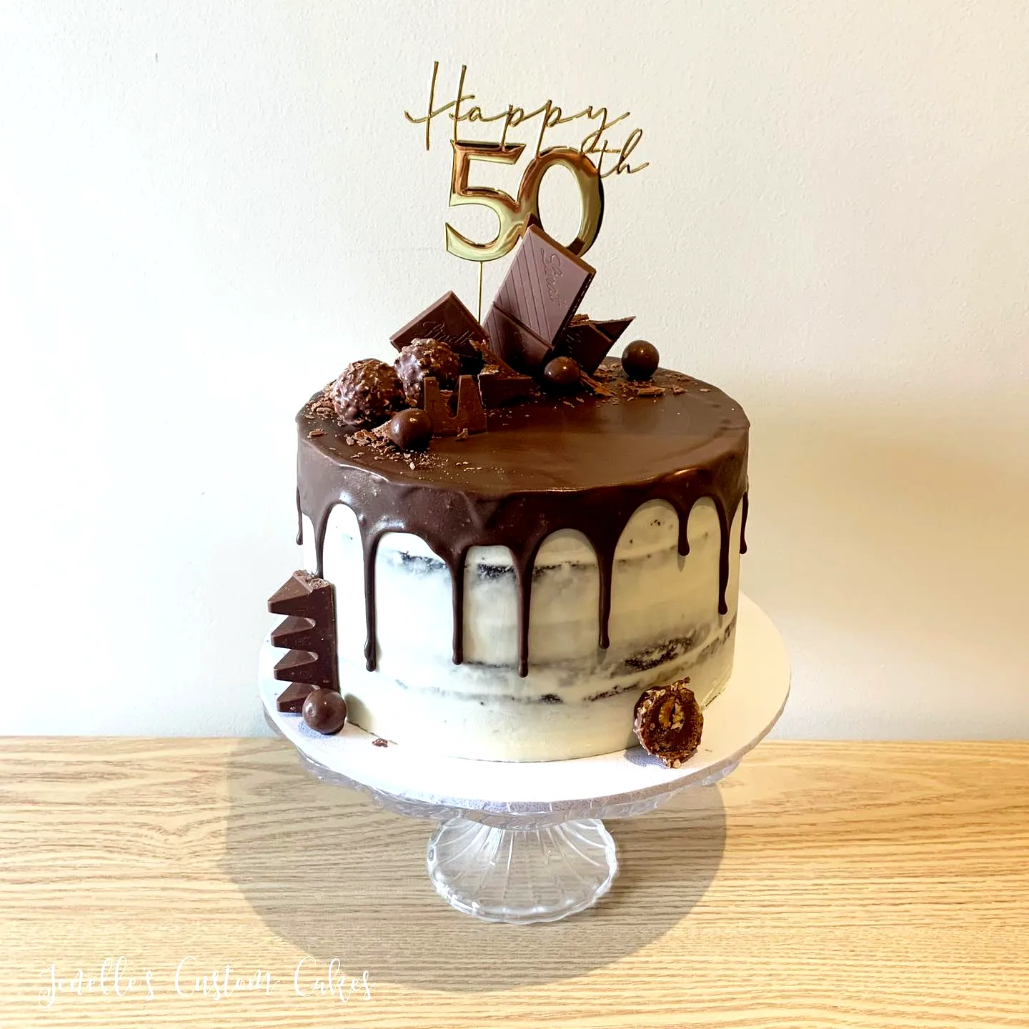 Elegant 50th Birthday Cake with Chocolate Ganache and Golden Topper