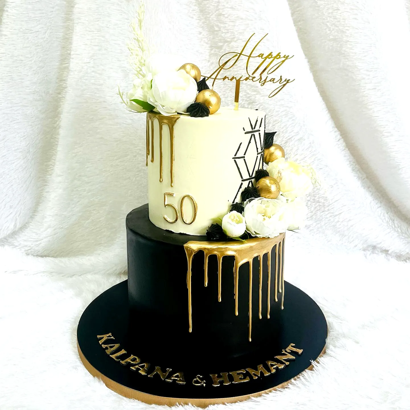 Elegant 50th Wedding Anniversary Cake with Gold and Floral Decorations